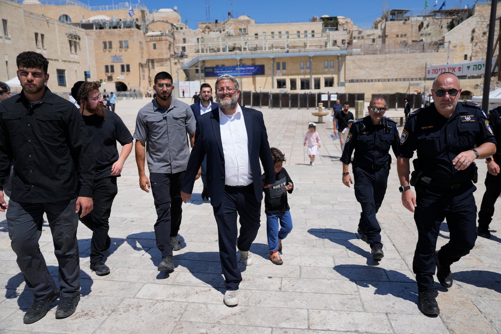 FILE - Israel's far-right National Security Minister Itamar Ben-Gvir, center, flanked by his security detail, approach the entrance to Jerusalem's most sensitive holy site in the Old City, on Aug. 13, 2024. (AP Photo/Ohad Zwigenberg, File)