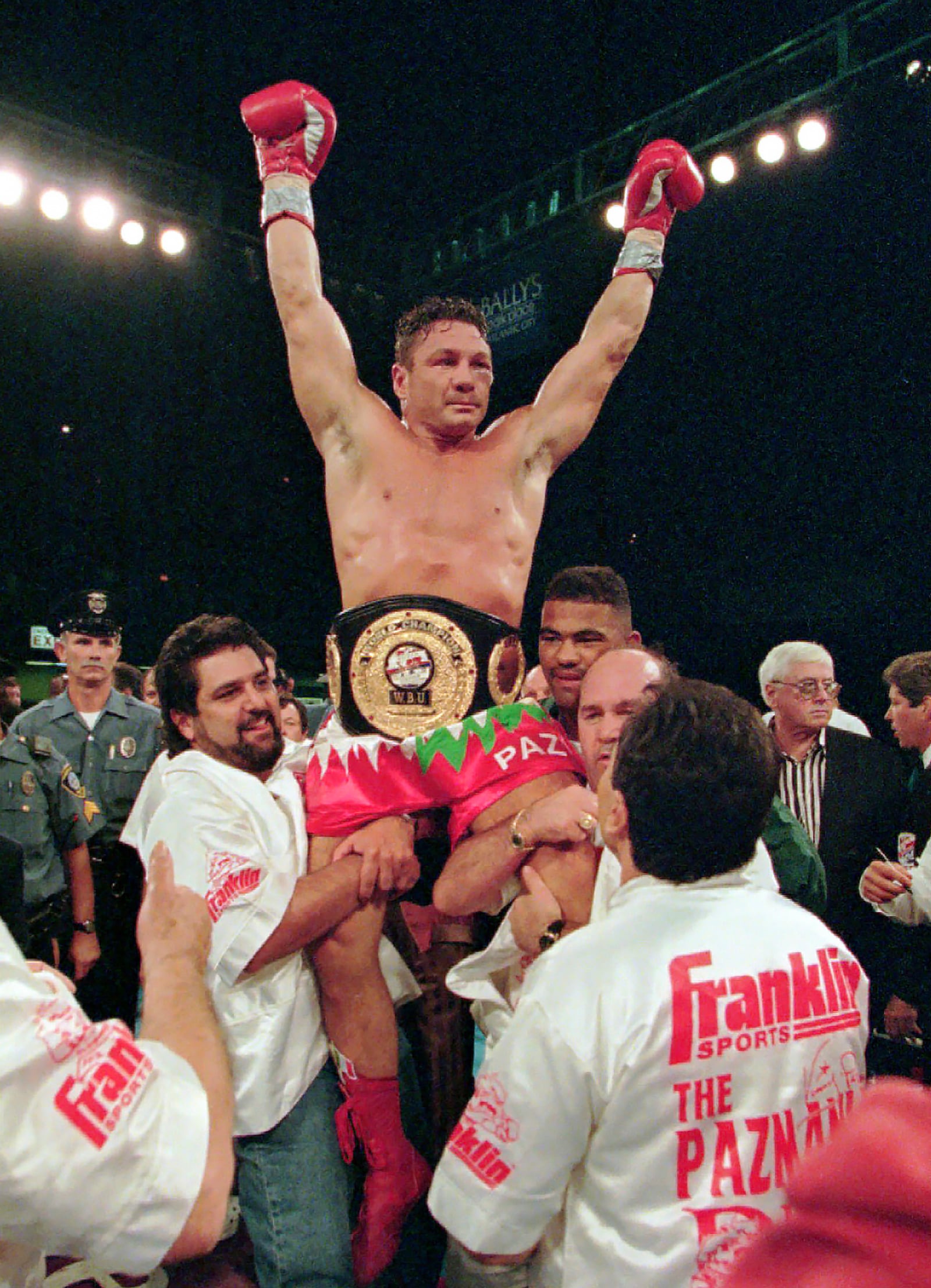 FILE - In this Aug. 23, 1996 file photo, boxer Vinny Pazienza, of Providence, R.I., is lifted up after winning a 12 round WBU super middleweight title bout against Dana Rosenblatt in Atlantic City, N.J. (AP Photo/Bill Borrelli, File)