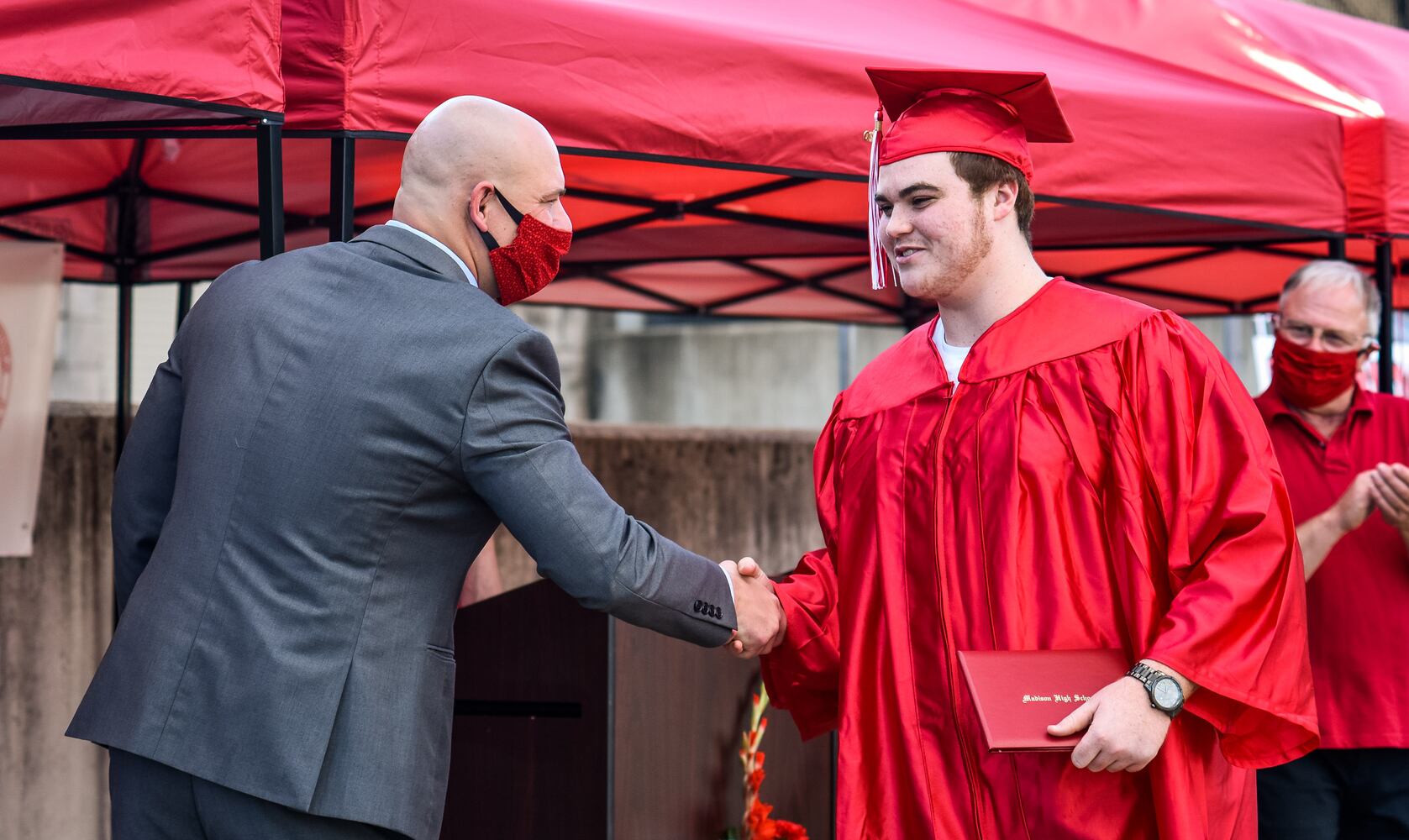 Madison High School drive-thru graduation ceremony at Land of Illusion