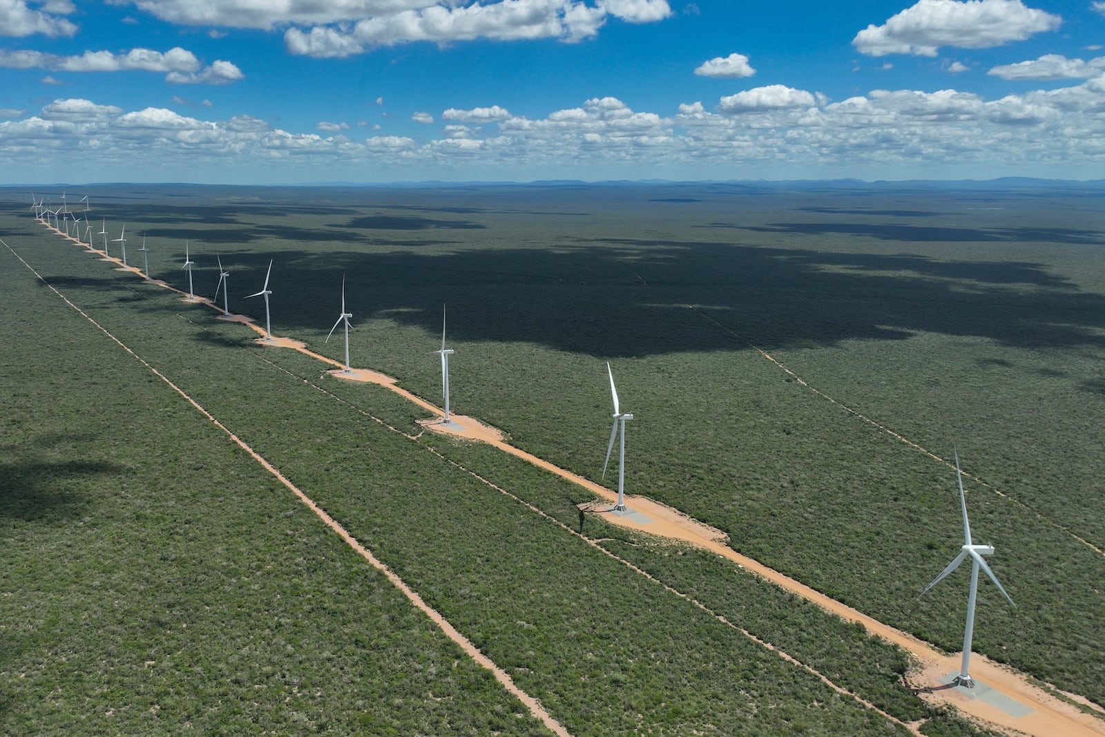 FILE - Wind turbines operate in a rural area near Canudos, Bahia state, Brazil, March 9, 2024. (AP Photo/Andre Penner, File)