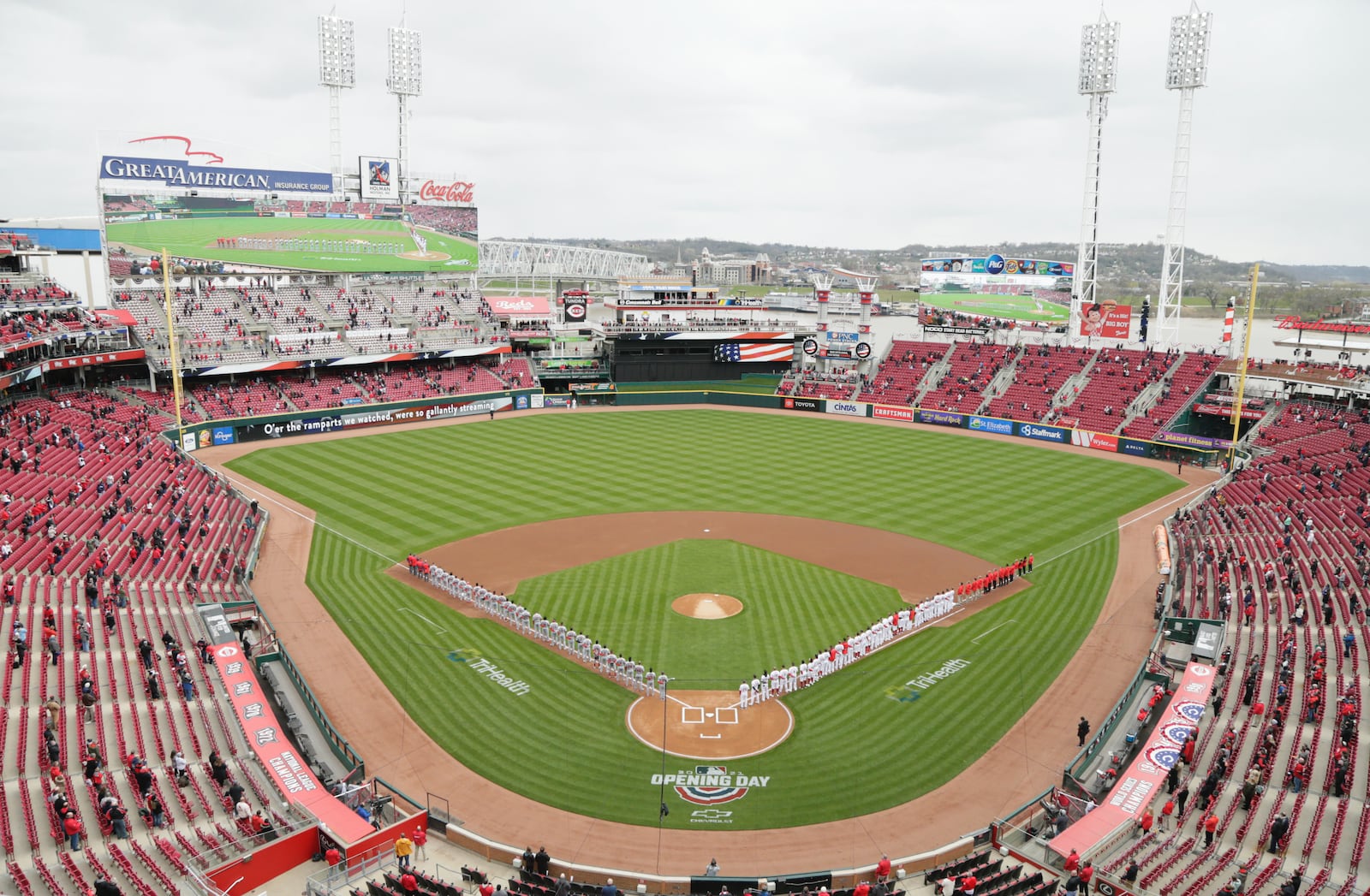 The Reds and Cardinals stand for the national anthem on Opening Day on Thursday, April 1, 2021, at Great American Ball Park in Cincinnati. David Jablonski/Staff