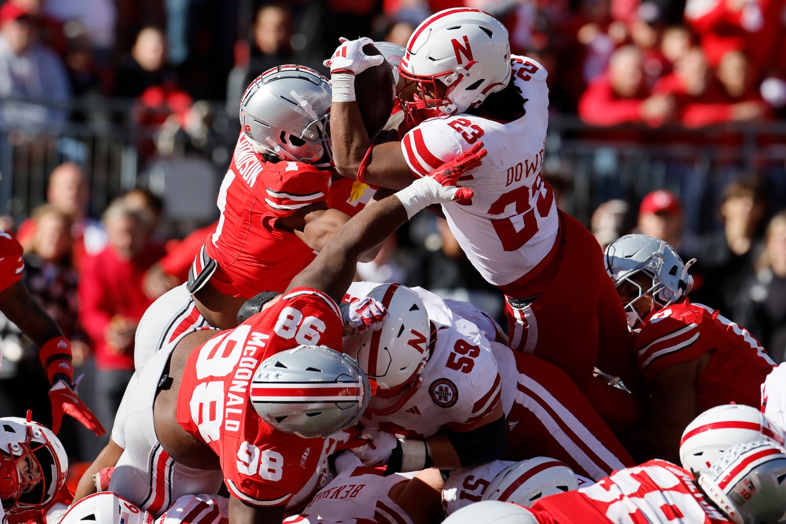 Ohio State defensive back Davison Igbinosun, left, stops Nebraska running back Dante Dowdell on fourth and goal during the second half of an NCAA college football game Saturday, Oct. 26, 2024, in Columbus, Ohio. (AP Photo/Jay LaPrete)