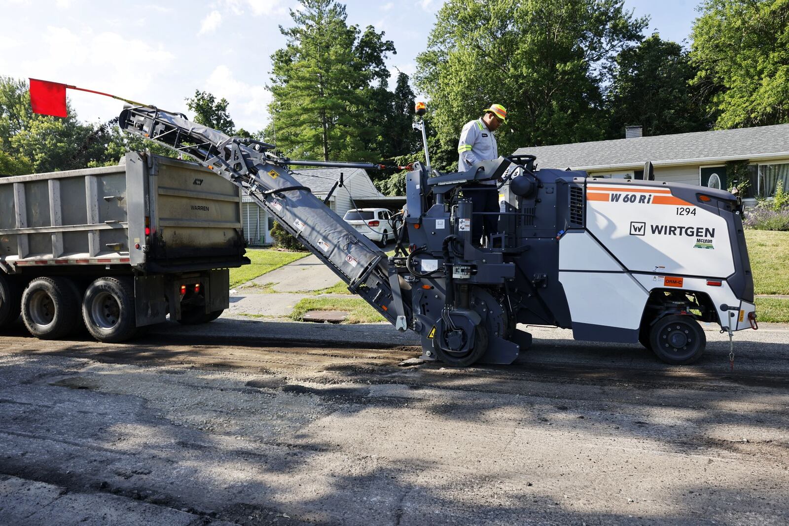 City of Hamilton street crew grinds a section of Weinman Dr. with their new milling machine before repaving Tuesday, June 25, 2024. NICK GRAHAM/STAFF