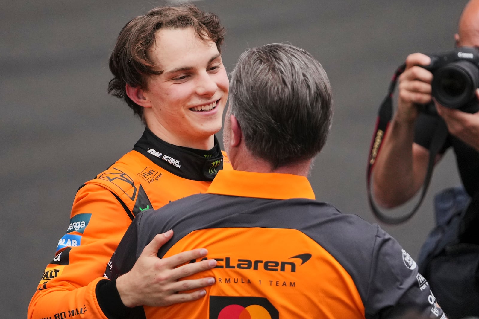 McLaren driver Oscar Piastri of Australia celebrates with Zak Brown, McLaren boss after winning the Chinese Formula One Grand Prix race at the Shanghai International Circuit, Shanghai, Sunday, March 23, 2025. (AP Photo/Andy Wong)