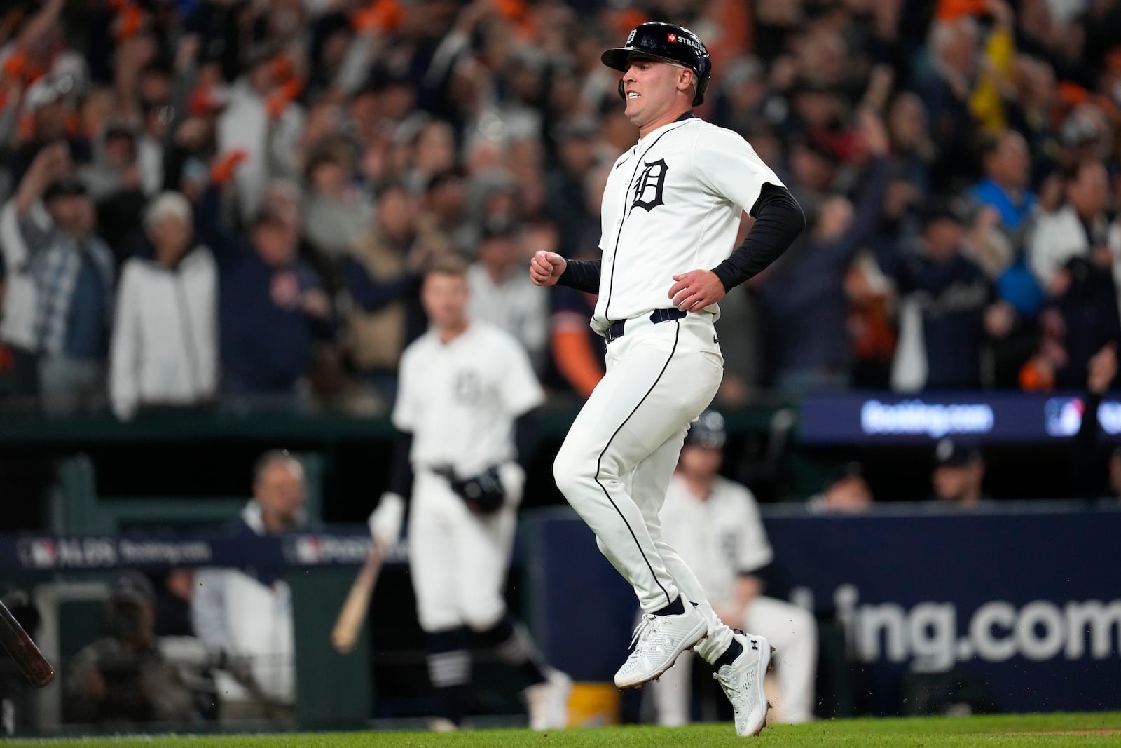 Detroit Tigers' Kerry Carpenter reacts after scoring in the sixth inning during Game 4 of a baseball American League Division Series against the Cleveland Guardians, Thursday, Oct. 10, 2024, in Detroit. (AP Photo/Paul Sancya)