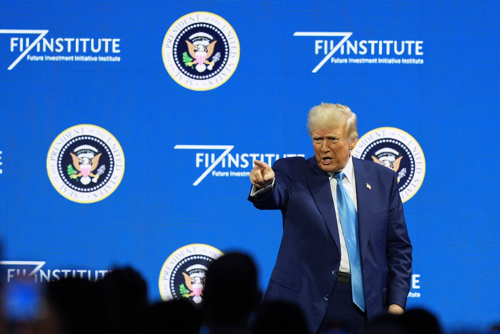 President Donald Trump gestures at the Future Investment Initiative (FII) Institute summit in Miami Beach, Fla., Wednesday, Feb. 19, 2025. (AP Photo/Rebecca Blackwell)