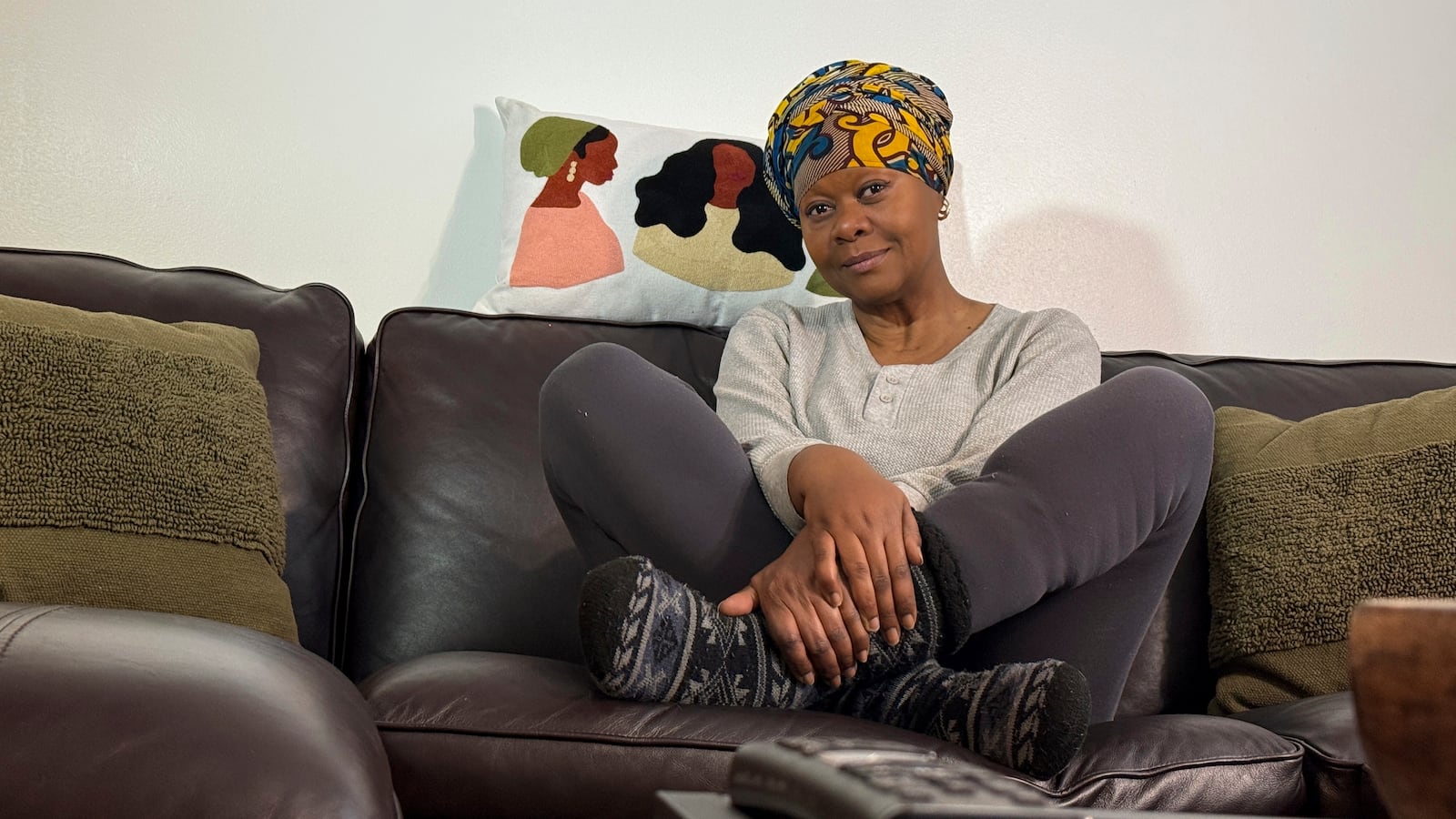 Julieta Lopez poses for a photo at her Boston home, Friday, Jan. 10, 2025, some two years after she bought her first home, capping a 30-year pursuit of homeownership. (AP Photo/Rodrique Ngowi)