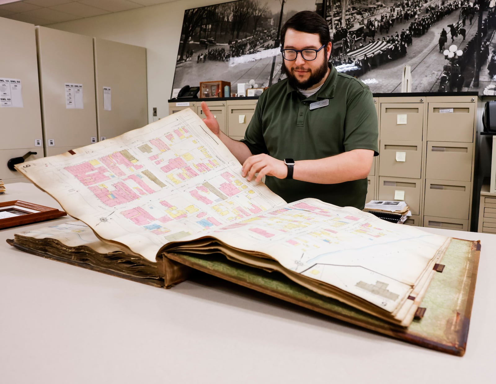 Brad Spurlock, manager of Smith Library of Regional History and Cummins Local History Room at Lane Library in Hamilton, shows off an insurance map of the city of Hamilton at Smith Library of Regional History housed on the second floor of the Lane Library in Oxford. The mission of Smith Library is to collect, preserve, and disseminate information on the history of southwestern Ohio. NICK GRAHAM/STAFF