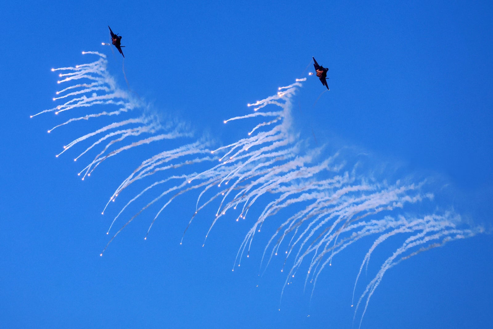 South Korean Air Force F-35A fighter jets fire flare shells during the joint military drill between South Korea and the United States at Seungjin Fire Training Field in Pocheon, South Korea, Thursday, March 6, 2025. (Yonhap via AP)