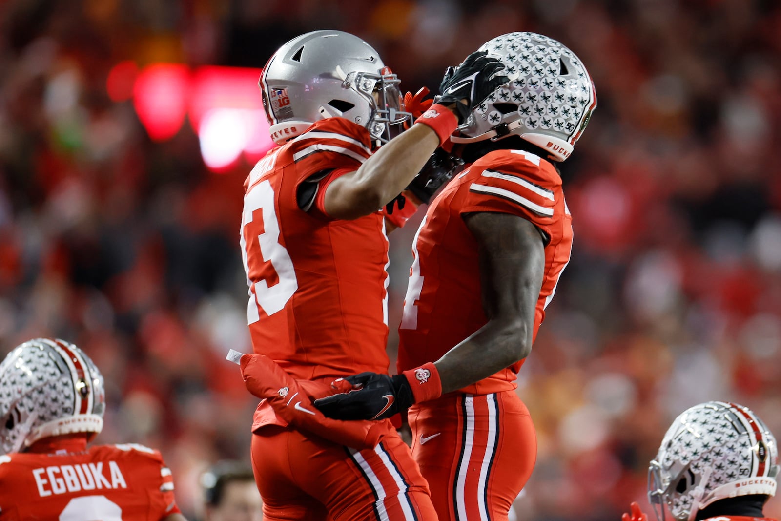 Ohio State receiver Jeremiah Smith, right, celebrates his touchdown against Tennessee with teammate Bryson Rodgers during the first half in the first round of the College Football Playoff, Saturday, Dec. 21, 2024, in Columbus, Ohio. (AP Photo/Jay LaPrete)