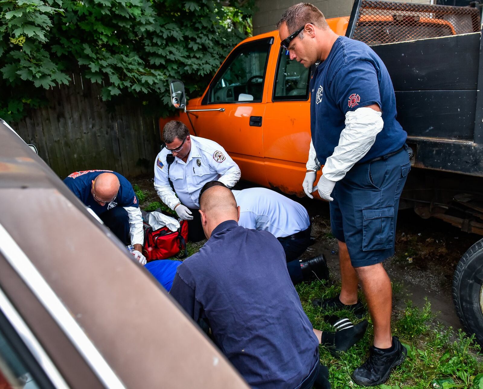 Middletown paramedics and police officers responded to a drug overdose behind the Midd-Town Carry Out on Central Avenue Monday, June 26, in Middletown. Emergency personnel found a man unconscious, lying between two vehicles across the alley. NICK GRAHAM/STAFF