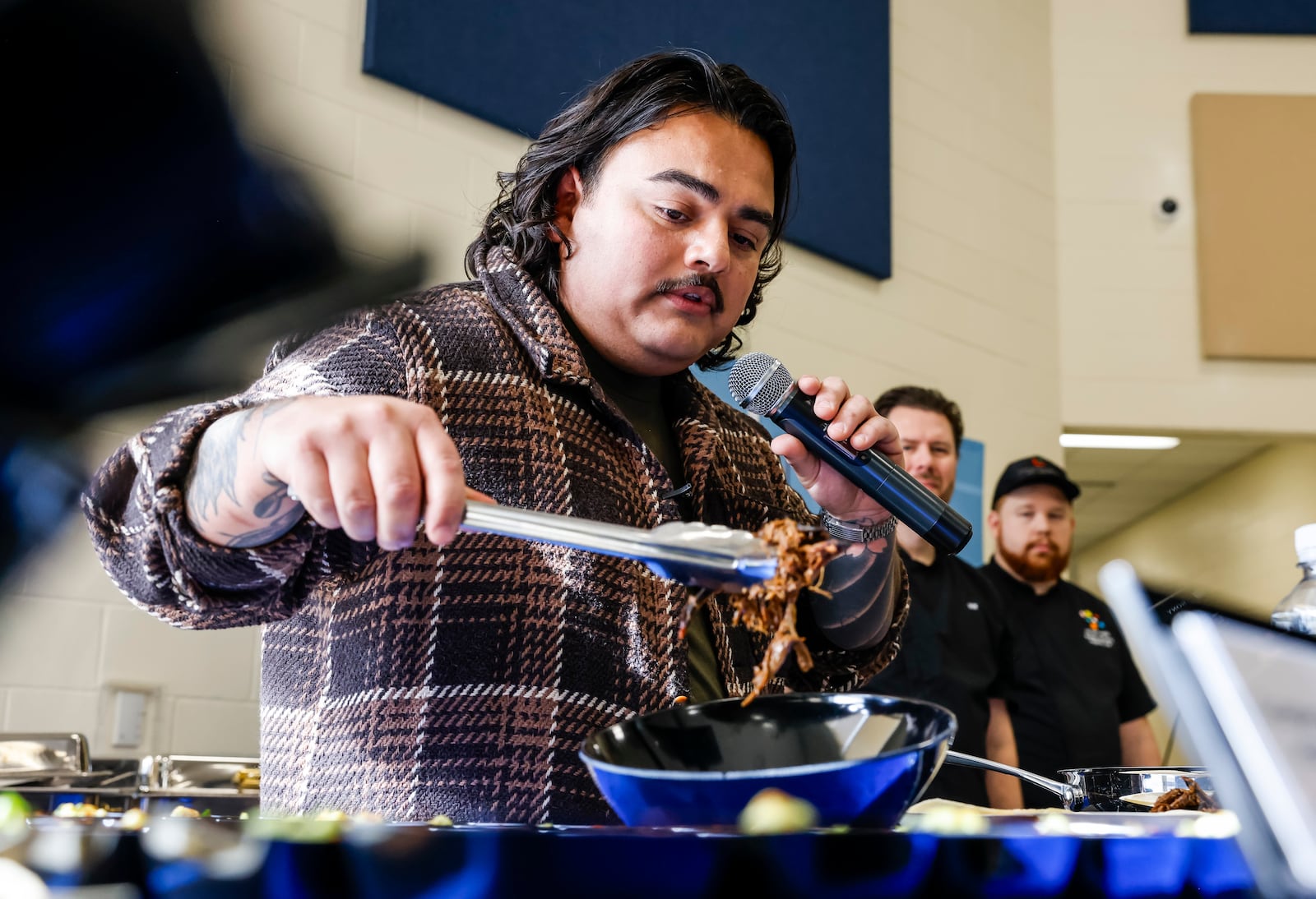 Chef Jonathan Zaragoza visited Hamilton Freshman School Thursday, Feb. 1, 2024 to help highlight the unique ingredients and authentic recipes from “Global Eats,” a new program from food service partner Chartwells K12 that invites students on a journey to explore cuisines from around the world without leaving the cafeteria. Students were able to sample several Global Eats recipes from Mexico that Chef Zaragoza  helped create. Zaragoza's Chicago restaurant, Birrieria Zaragoza, was featured in an episode of the Netflix show "Taco Chronicles" in 2022. NICK GRAHAM/STAFF