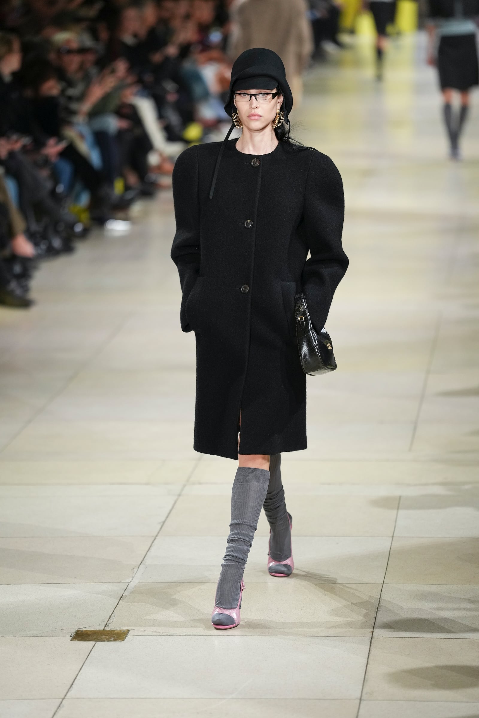 A model wears a creation as part of the Miu Miu Fall/Winter 2025-2026 Womenswear collection presented Tuesday, March 11, 2025. in Paris. (Photo by Scott A Garfitt/Invision/AP)