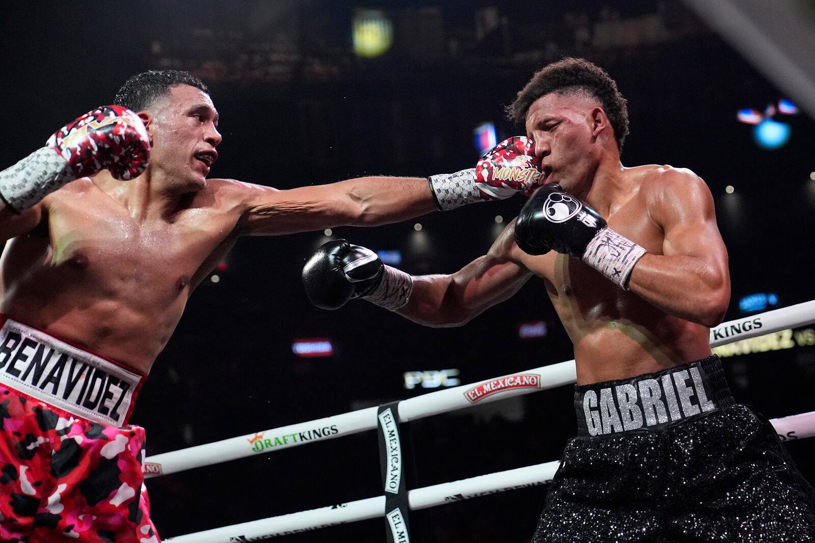 David Benavidez lands a left to David Morrell during a light heavyweight title boxing match Saturday, Feb. 1, 2025, in Las Vegas. (AP Photo/John Locher)