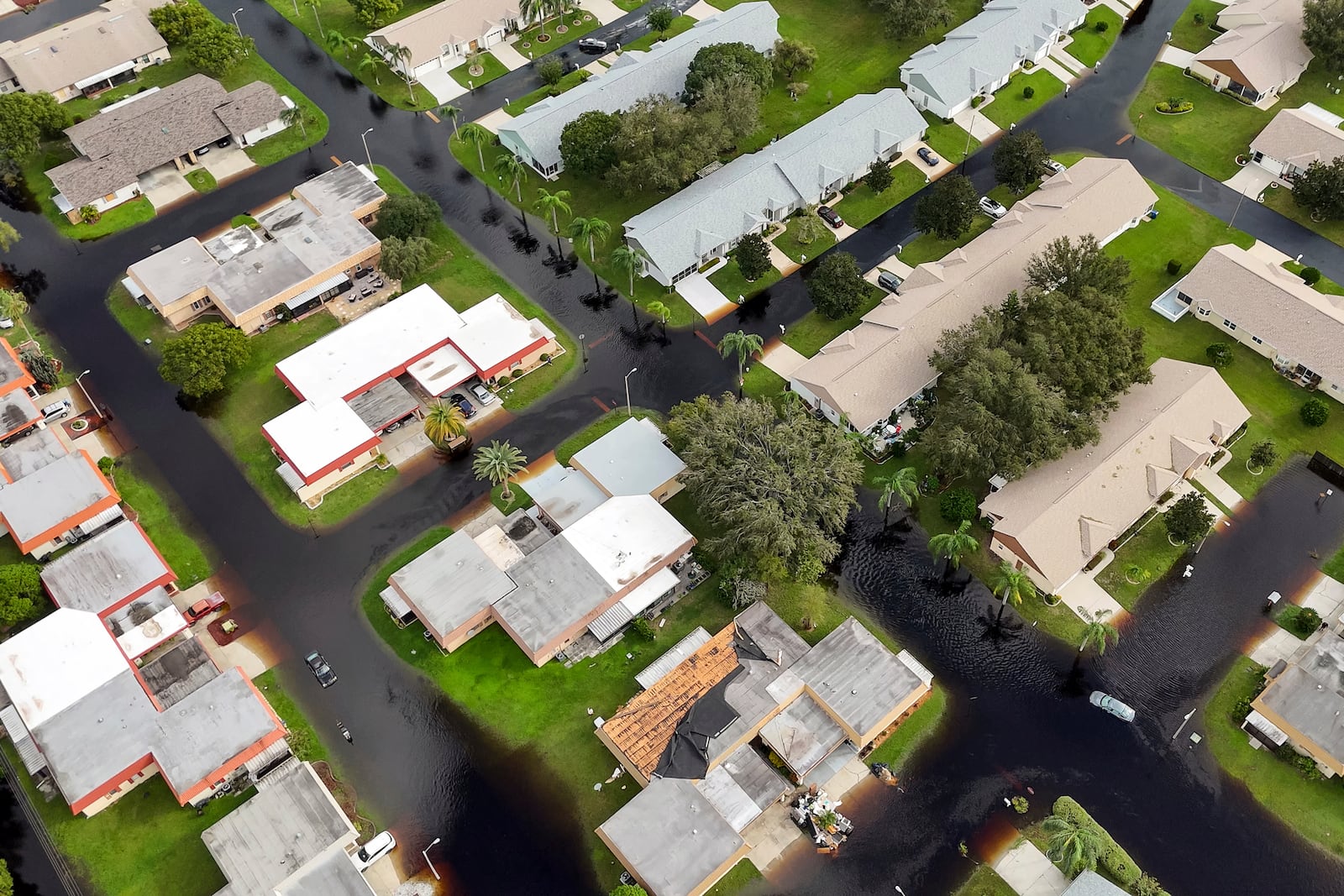 Waters rise in Pasco County neighborhoods as intense rain from Hurricane Milton caused the Anclote River to flood, Friday, Oct. 11, 2024, in New Port Richey, Fla. (AP Photo/Mike Carlson)