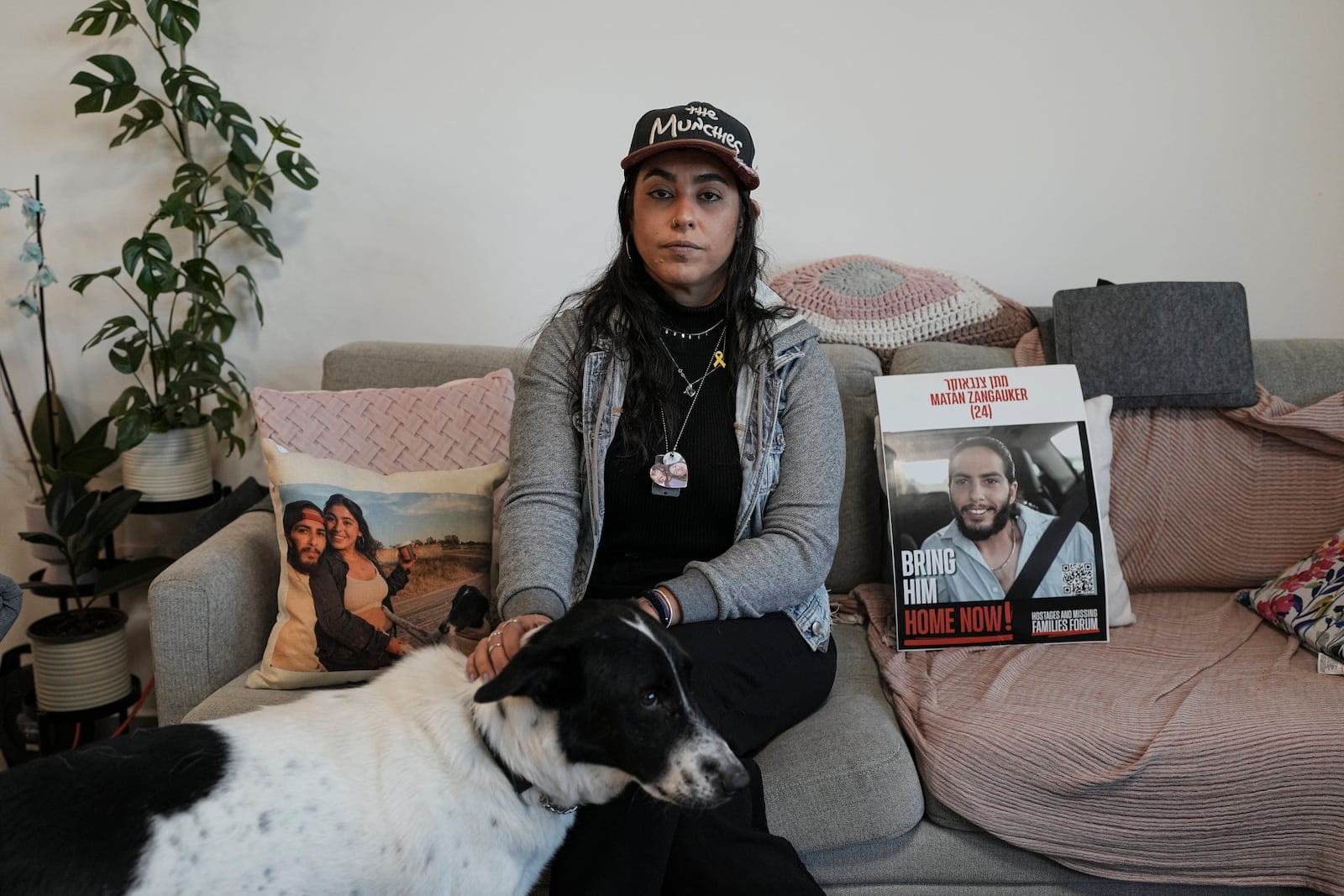 FILE -Released hostage Ilana Gritzewsky poses for a portrait in her apartment in Kiryat Gat, Israel, on Dec. 15, 2024, near photos of her boyfriend, Matan Zangauker, who is being held hostage by Hamas in the Gaza Strip. (AP Photo/Tsafrir Abayov), File)