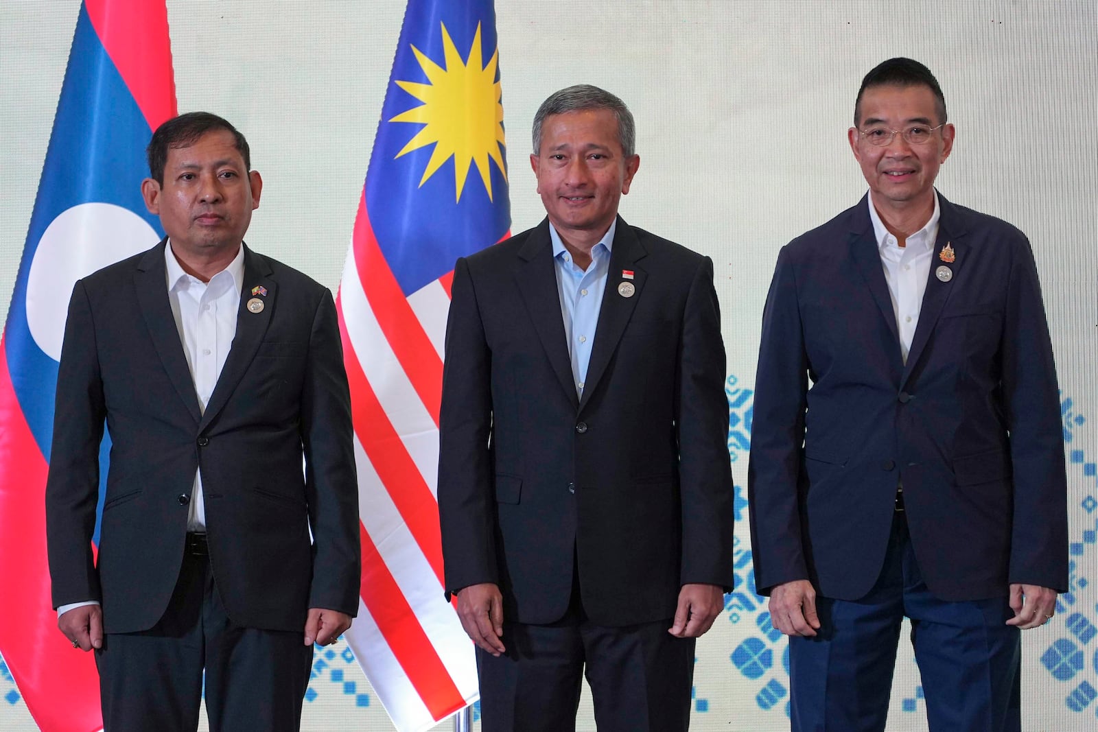 From left to right, Myanmar's Permanent Secretary to ASEAN Aung Kyaw Moe, Singapore's Minister of Foreign Affairs Vivian Balakrishnan and Thailand's Minister of Foreign Affairs Maris Sangiampongsa pose for a photo before a retreat session during the ASEAN Foreign Ministers' Retreat (AMM) in Langkawi Island, Malaysia, on Sunday, Jan. 19, 2025. AP Photo/Azneal Ishak, Pool)