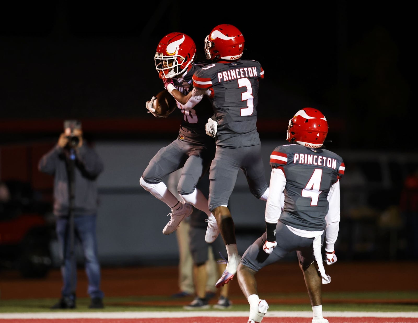 Princeton's Ryan O'bryant, left, celebrates a touchdown with teammate Antonio Hunter during their 37-7 win over Hamilton in their playoff football game Friday, Nov. 8, 2024 at Princeton High School in Sharonville. NICK GRAHAM/STAFF