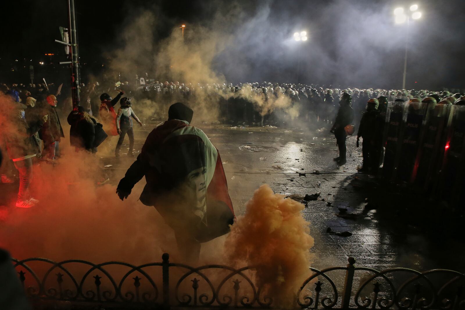 Riot police officers clash with protesters during a protest after Istanbul's Mayor Ekrem Imamoglu was arrested and sent to prison, in Istanbul, Turkey, Sunday, March 23, 2025. (AP Photo/Huseyin Aldemir)