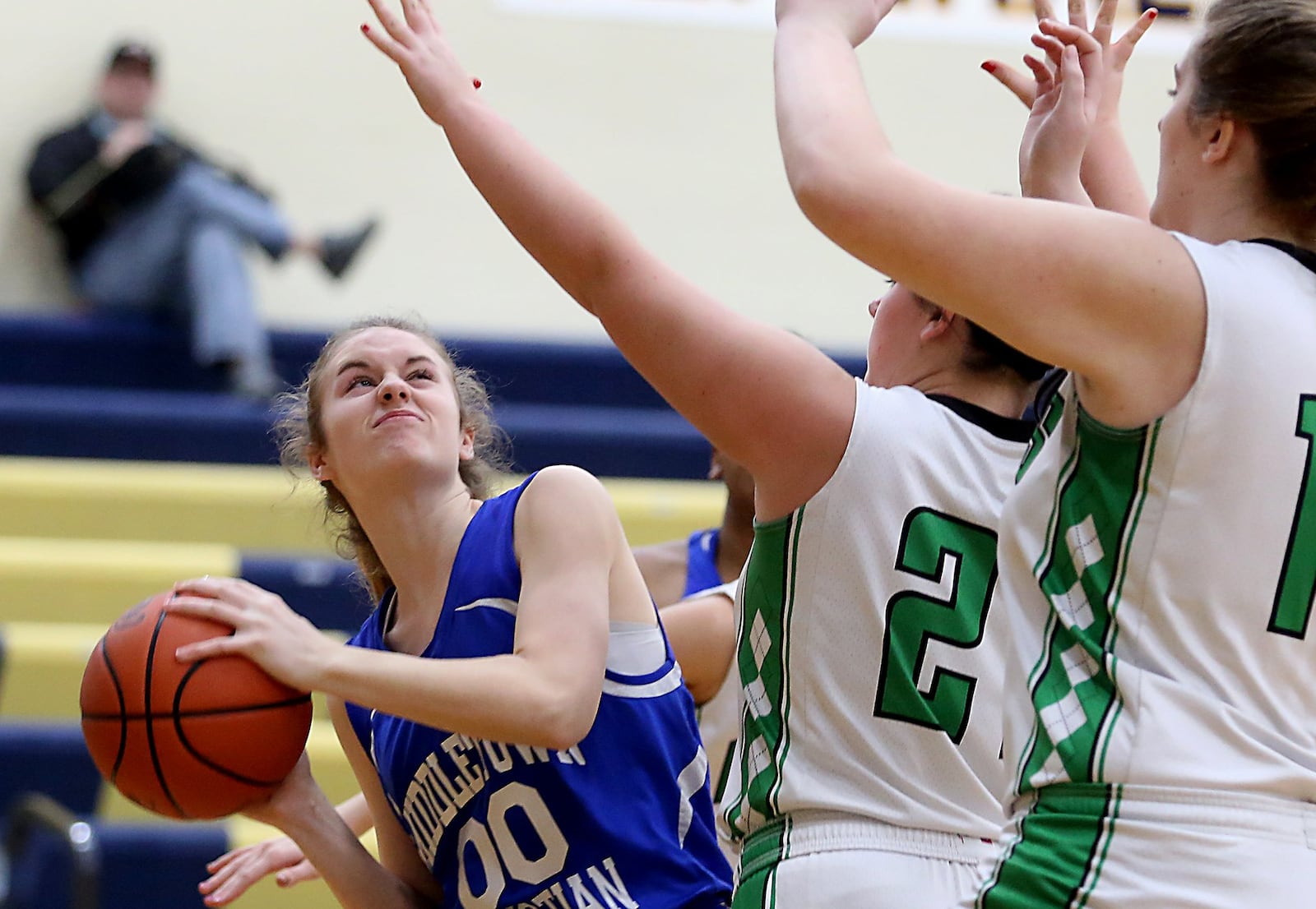 Middletown Christian’s Anna Crawford maneuvers in an attempt to get a clear shot while being covered by Fayetteville’s Haley Moore (21) and Margo Thompson (15) during their Division IV sectional at Monroe on Tuesday night. CONTRIBUTED PHOTO BY E.L. HUBBARD