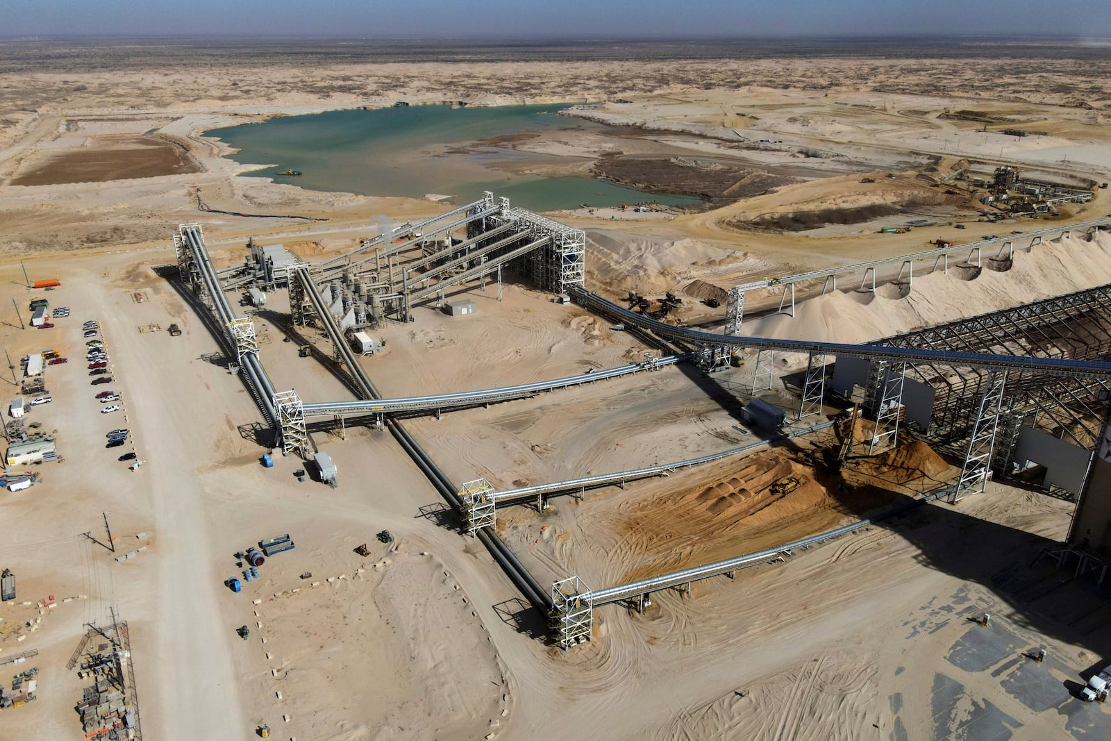 A general view shows Atlas Energy, at the beginning of a 42-mile conveyor belt that carries sand needed for hydraulic fracturing Wednesday, Feb. 26, 2025, in Kermit, Texas. (AP Photo/Julio Cortez)