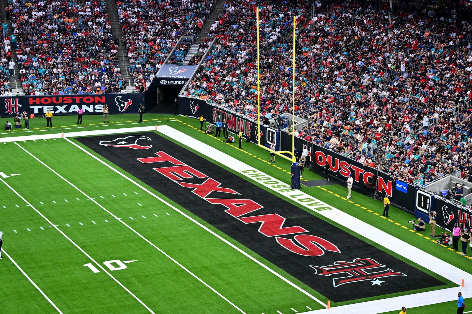 FILE - The word's "Choose Love" are displayed in the end zone during an NFL football game between the Miami Dolphins and the Houston Texas, Sunday, Dec 15, 2024 in Houston. (AP Photo/Maria Lysaker, File)