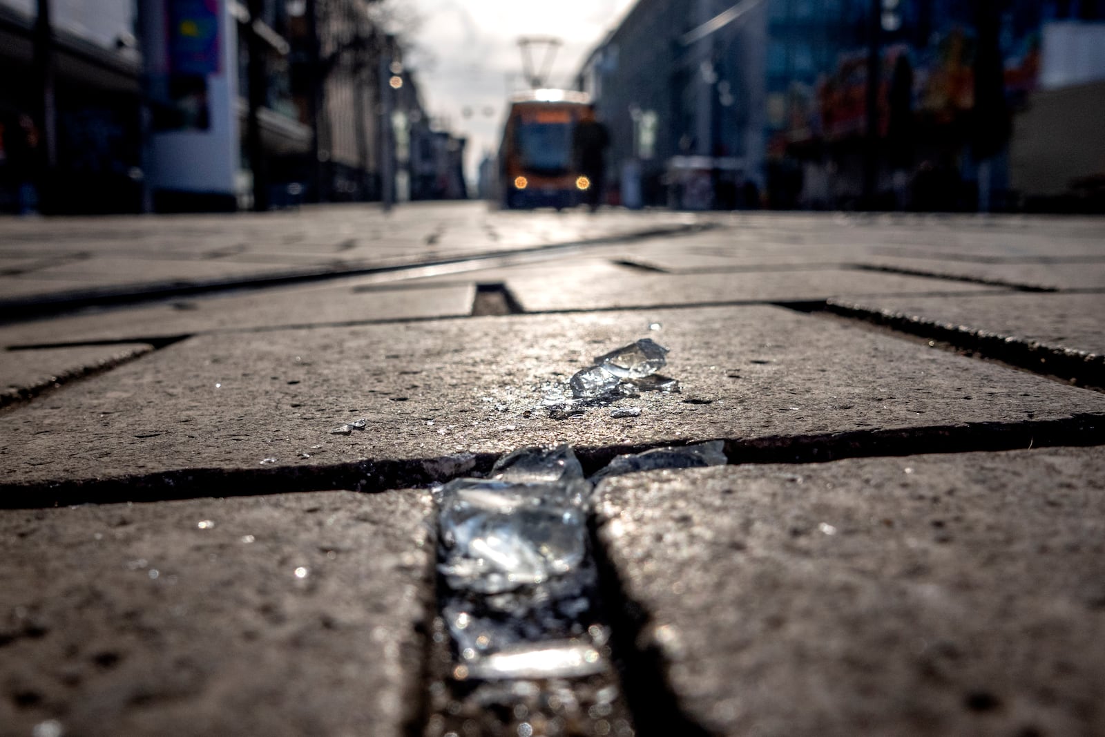 Broken glasses lie on a road in the city center of Mannheim, Germany, Tuesday, March 4, 2025, a day after a driver rammed a car into a crowd. (AP Photo/Michael Probst)