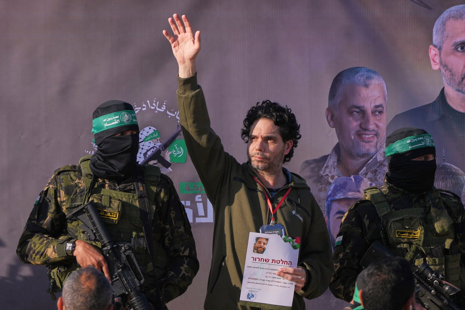 Israeli Ofer Kalderon who has been held hostage by Hamas in Gaza since October 7, 2023, waves before being handed over to the Red Cross by Hamas fighters in Khan Younis, southern Gaza Strip, Saturday Feb. 1, 2025. Photo/Abdel Kareem)