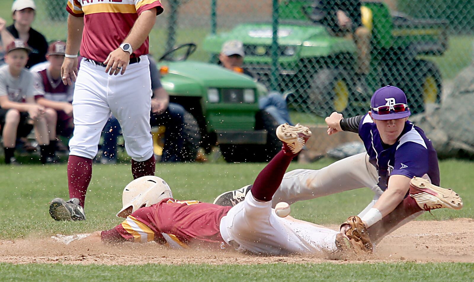 Andrew Beebe of Ross slides safely into third base as Dylan Payne of Columbus DeSales can’t handle the throw Friday during their Division II regional semifinal at Mason. CONTRIBUTED PHOTO BY E.L. HUBBARD