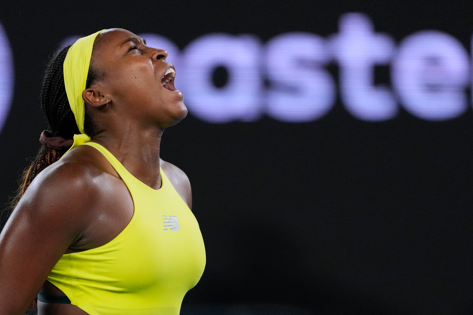 Coco Gauff of the U.S. reacts after winning a point against Jodie Burrage of Britain during their second round match at the Australian Open tennis championship in Melbourne, Australia, Wednesday, Jan. 15, 2025. (AP Photo/Vincent Thian)