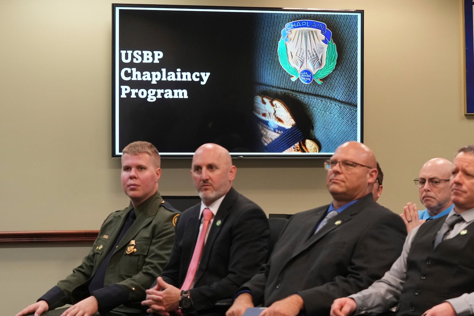 The USBP chaplaincy program class listen to remarks during their graduation, Thursday, Nov. 21, 2024, in Dania Beach, Fla. (AP Photo/Marta Lavandier)