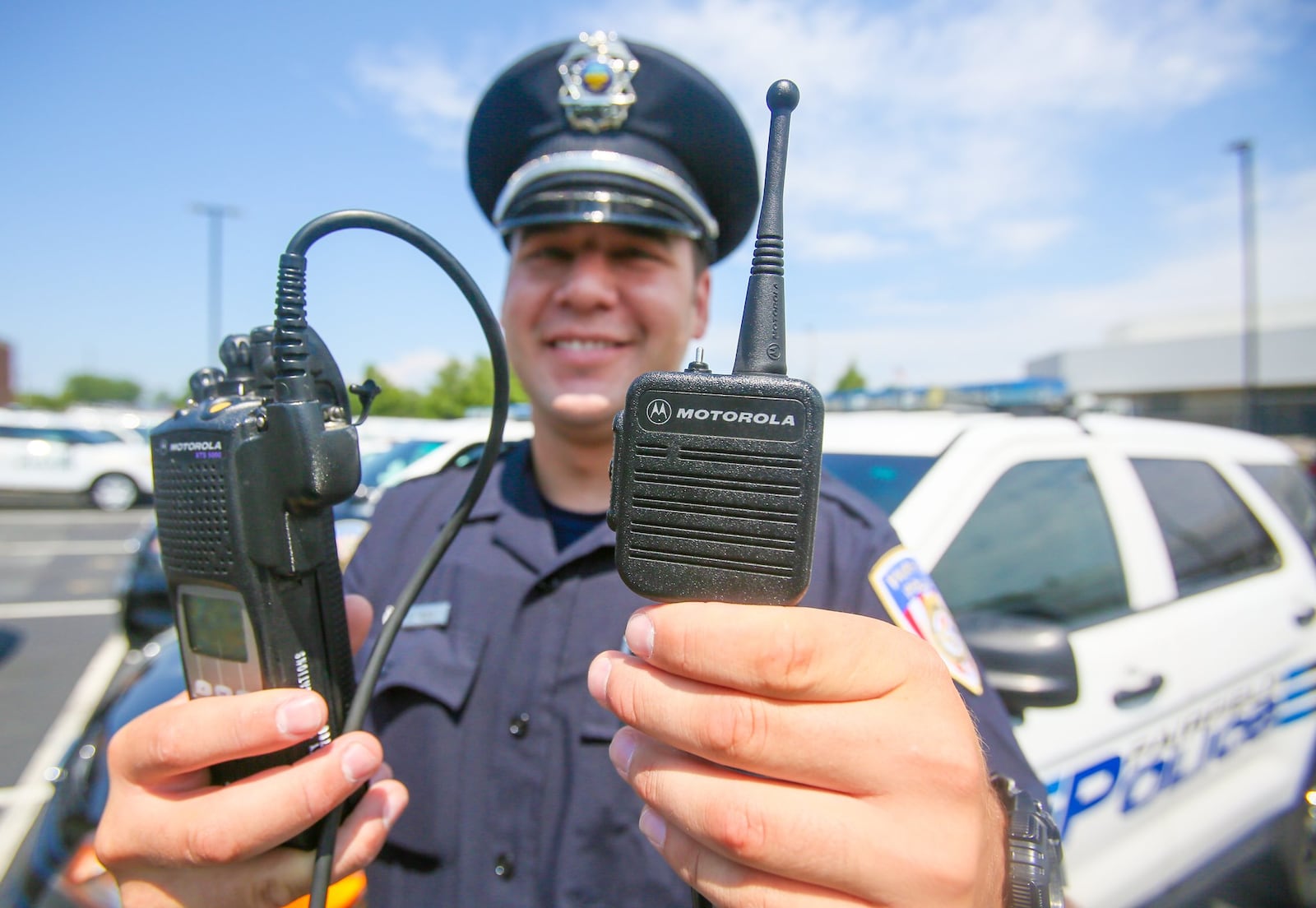 Fairfield police Officer Scott Webb displays his radio. Butler County commissioners inked a $10 million deal with Motorola for an upgrade of the emergency responder communications system. GREG LYNCH/STAFF