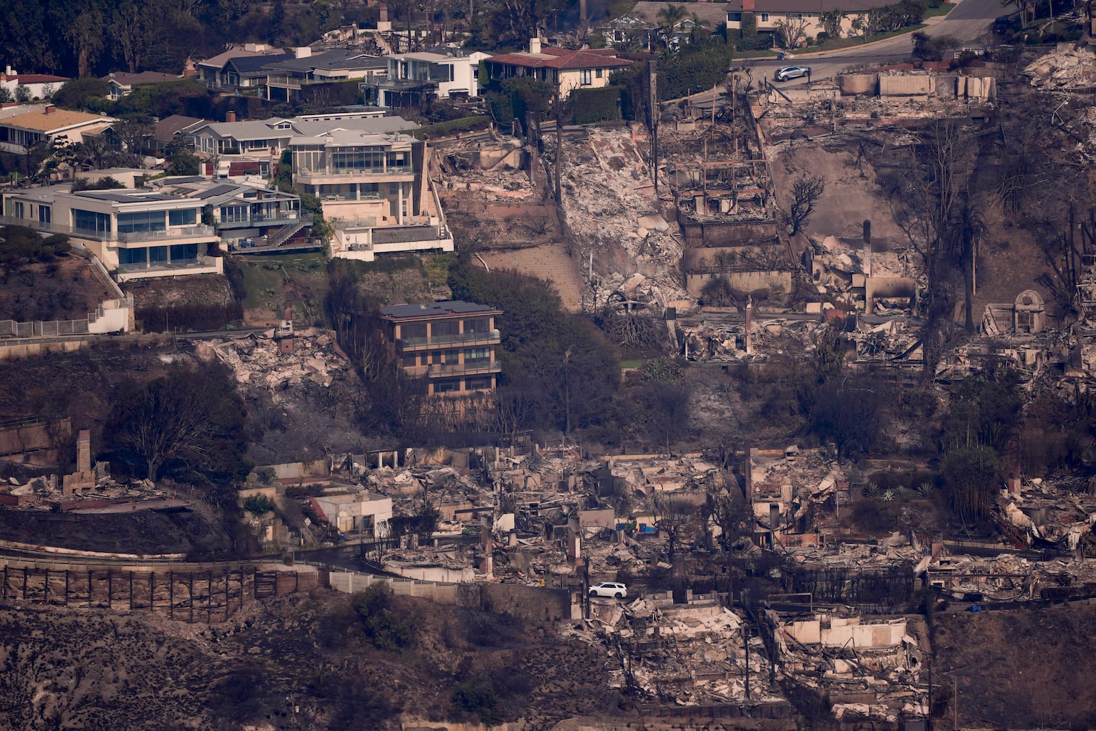 The devastation from the Palisades Fire is seen from the air in the Pacific Palisades neighborhood of Los Angeles, Thursday, Jan. 9, 2025. (AP Photo/Mark J. Terrill)