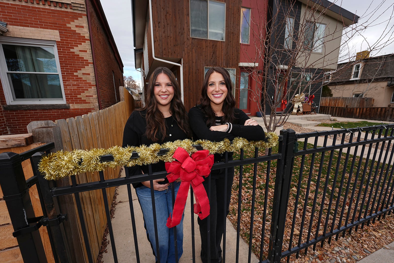 Jacqueline and Alexa Child stand for a portrait in their neighborhood Wednesday, Dec. 18, 2024, in Denver. (AP Photo/David Zalubowski)