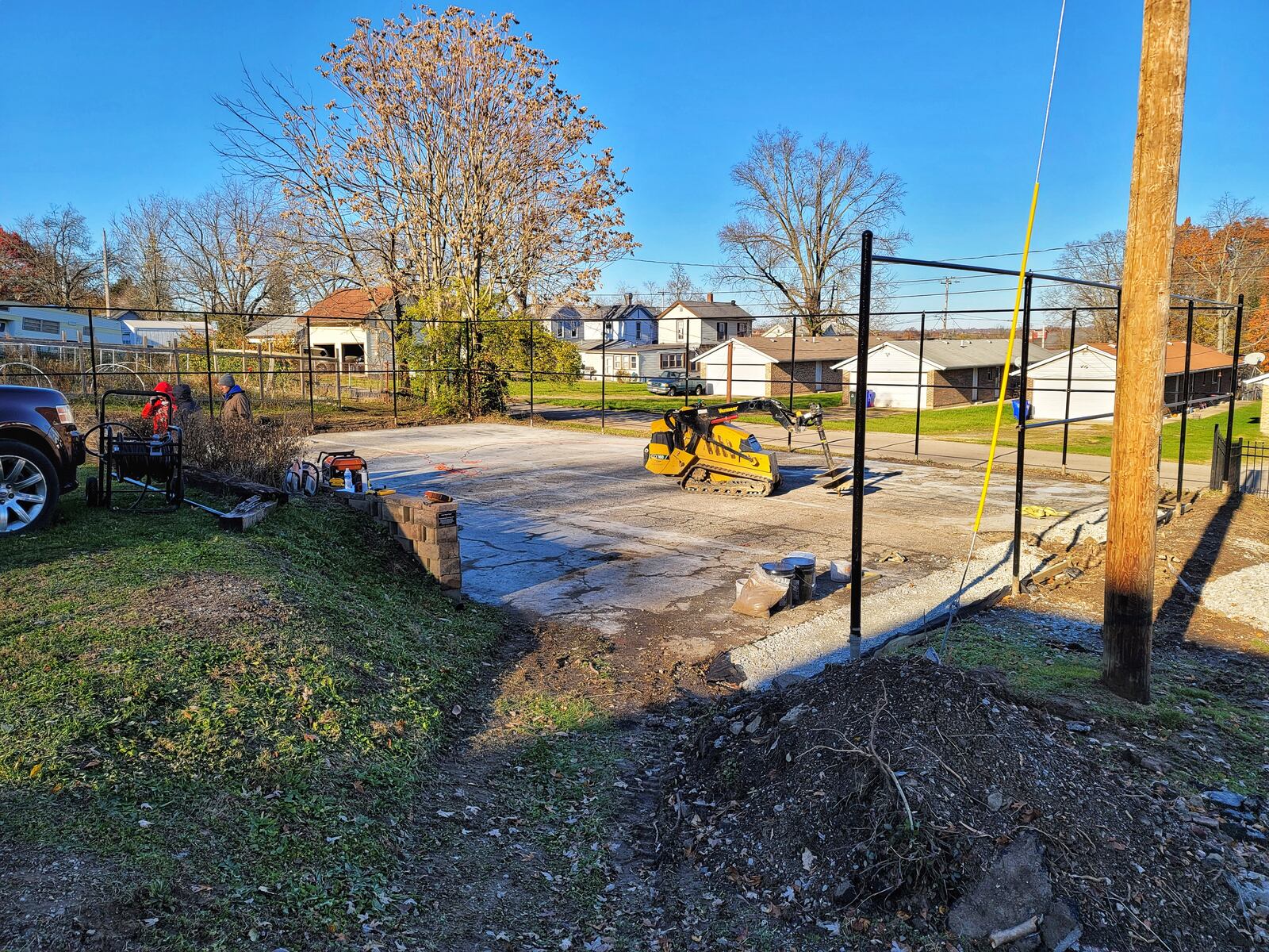 Tim and Kristan MacDonald are remodeling the sports courts on the property they are renovating that was formerly Butler County Children’s Home on S. D street in Hamilton.  NICK GRAHAM / STAFF