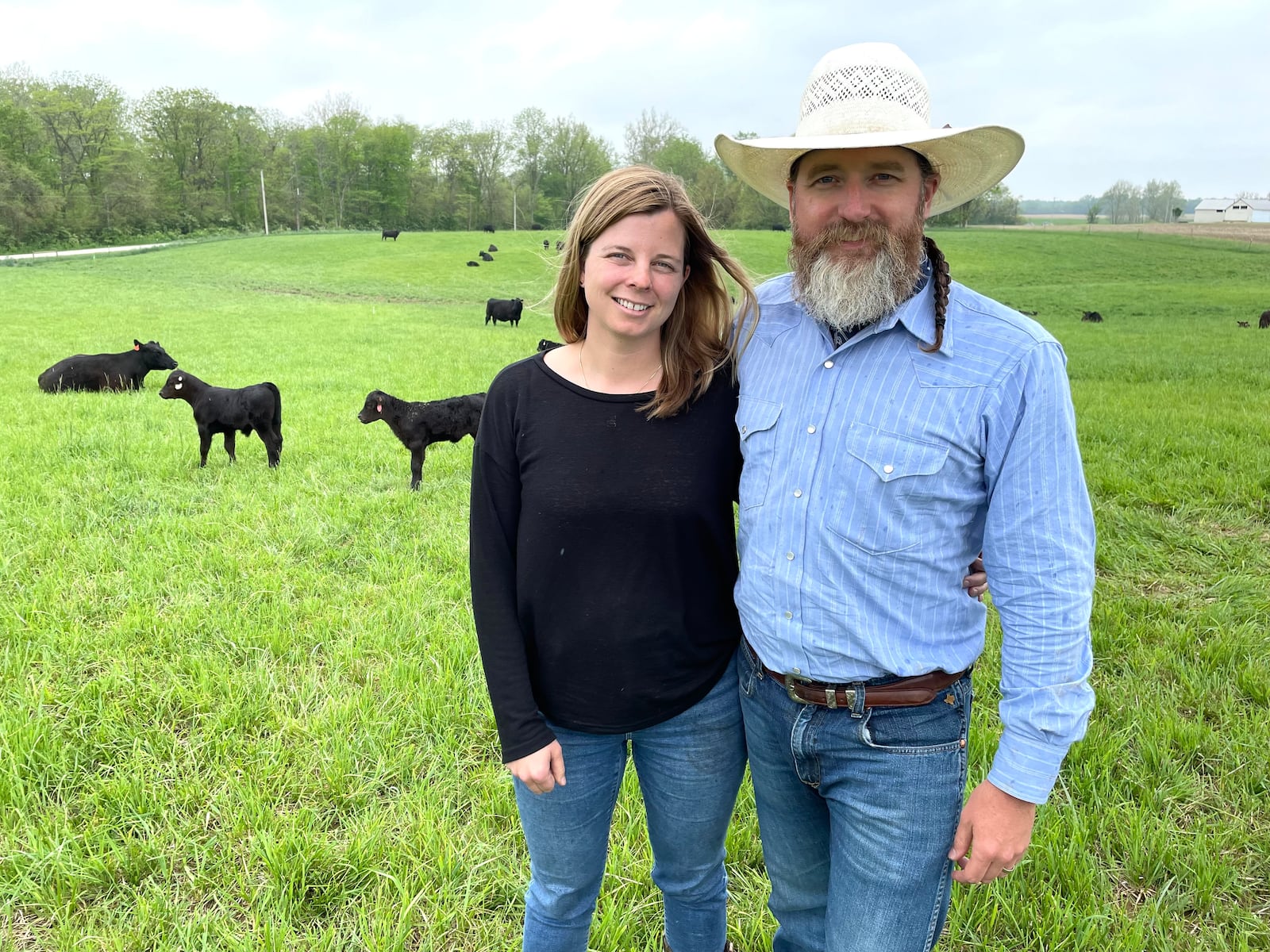 Honey Creek Beef is a closed herd cattle farm located at 6350 Addison-New Carlisle Road, just outside of Champaign County in New Carlisle. Pictured are owners Adam Frantz and his wife, Mia Grimes. NATALIE JONES/STAFF