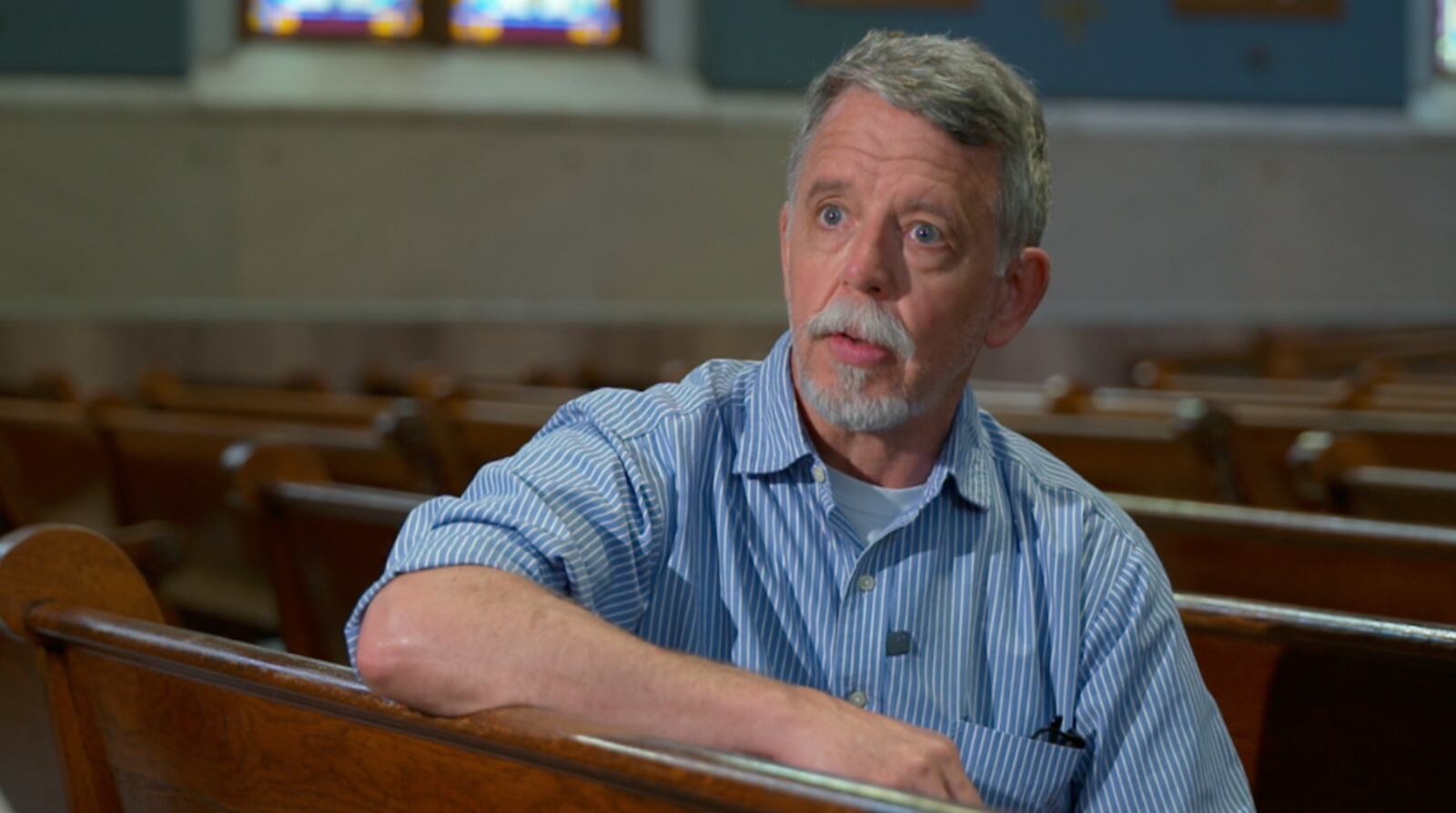 Henry Stacey, vice president of St. Francis Seraph Church parish council, said for now the church will not put up new fences on its property line to block crowds. RAY PFEFFER/WCPO