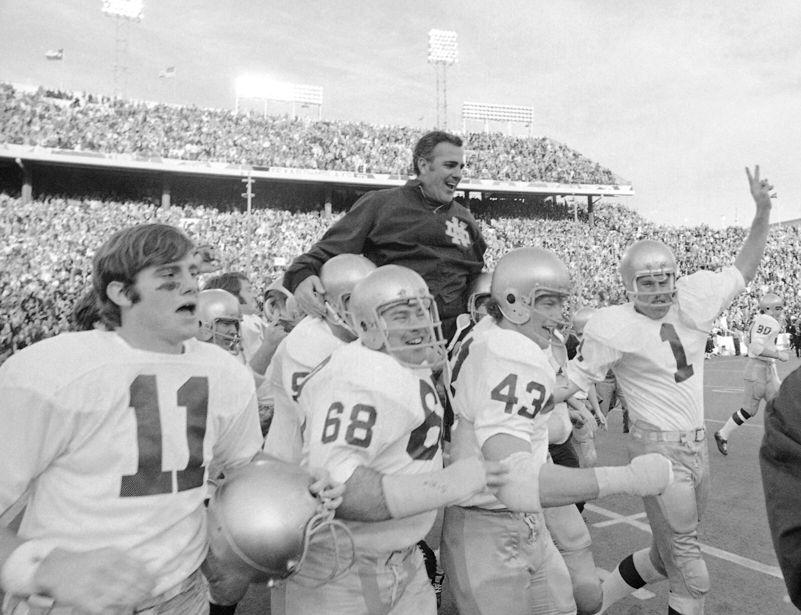 FILE - In this Jan. 1, 1971, file photo, Notre Dame coach Ara Parseghian is carried off the field by his players after defeating Texas, 24-11, in the Cotton Bowl NCAA college football game, in Dallas. Parseghian took over a foundering Notre Dame football program and restored it to glory with two national championships in 11 seasons. (AP Photo/File)