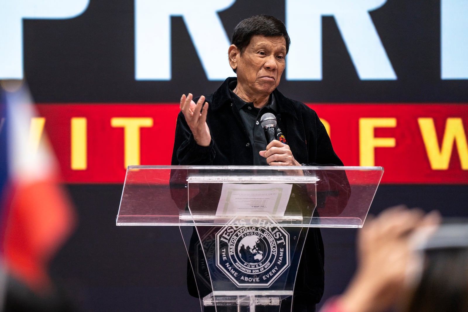 Former President of the Philippines Rodrigo Duterte speaks inside the Southorn Stadium during a thanksgiving gathering organized by Hong Kong-based Filipino workers for the former populist president in Hong Kong on Sunday, March 9, 2025. (AP Photo/Vernon Yuen)