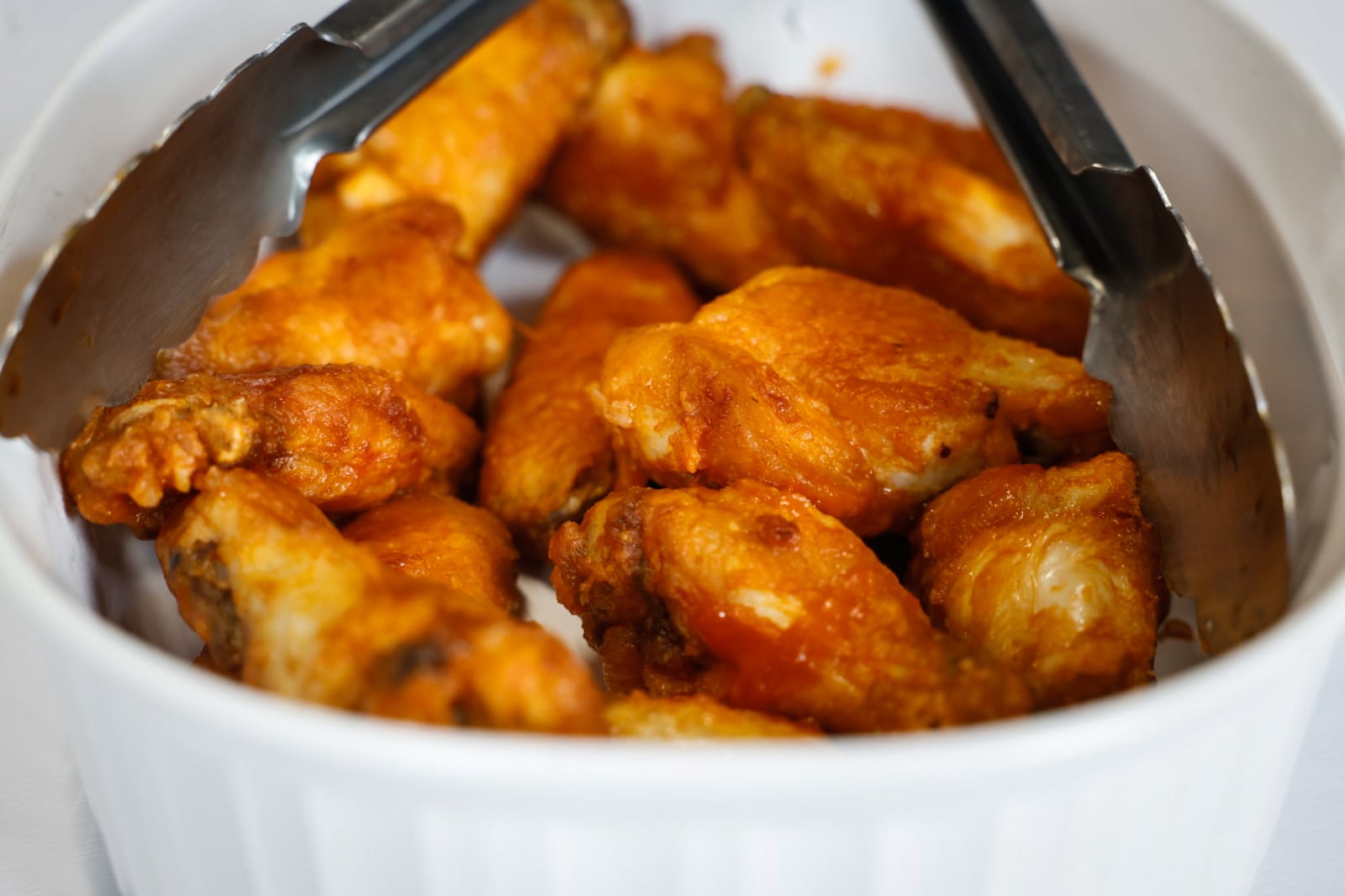 Cox First Media asked readers to submit their very best, easy-to-follow tailgating recipes. The Southern Style Hot Wings sent in by T.J. Justice of Moraine won third place. JIM NOELKER/STAFF