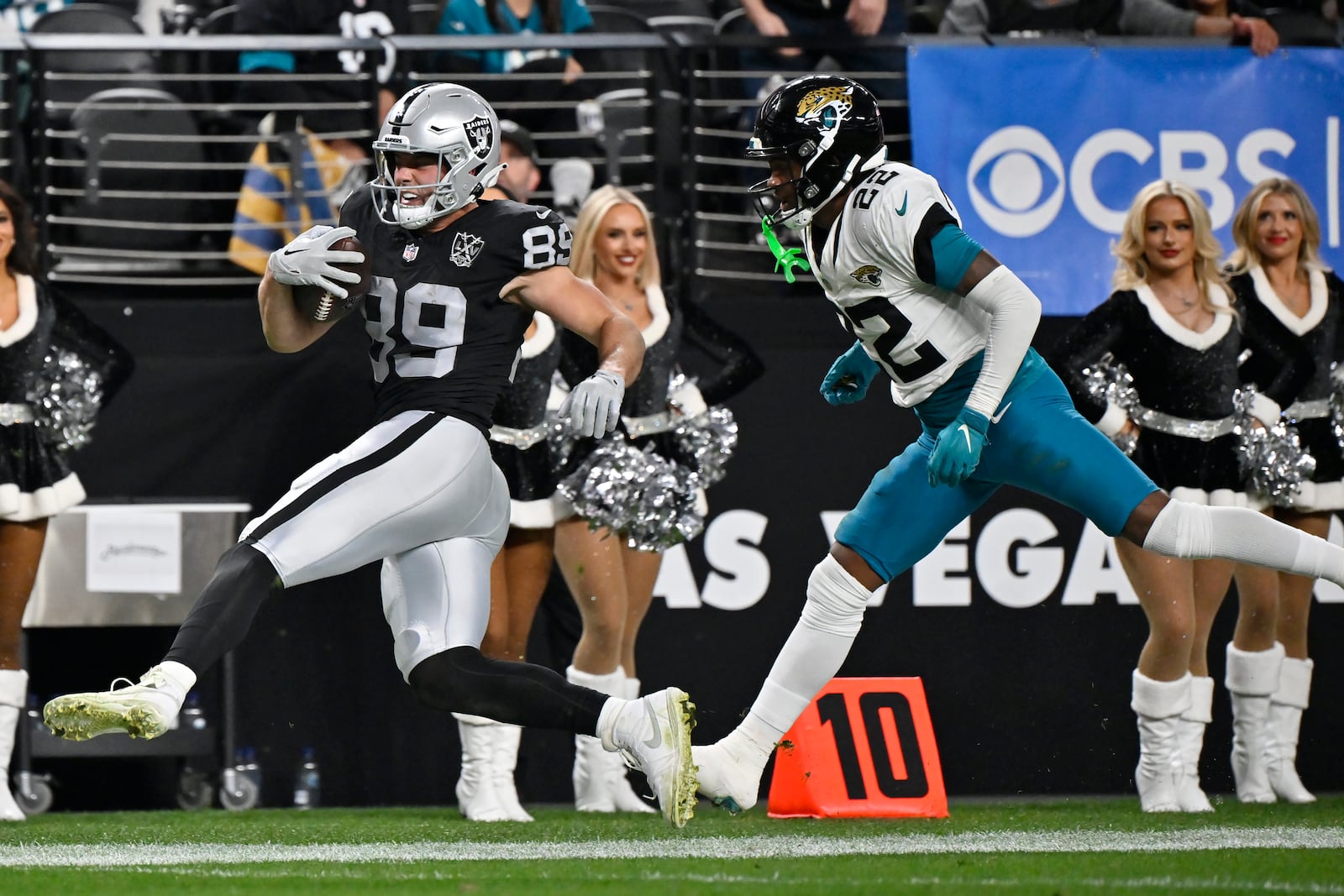 Las Vegas Raiders tight end Brock Bowers (89) runs with the ball against Jacksonville Jaguars cornerback Jarrian Jones (22) during the second half of an NFL football game Sunday, Dec. 22, 2024, in Las Vegas. (AP Photo/David Becker)