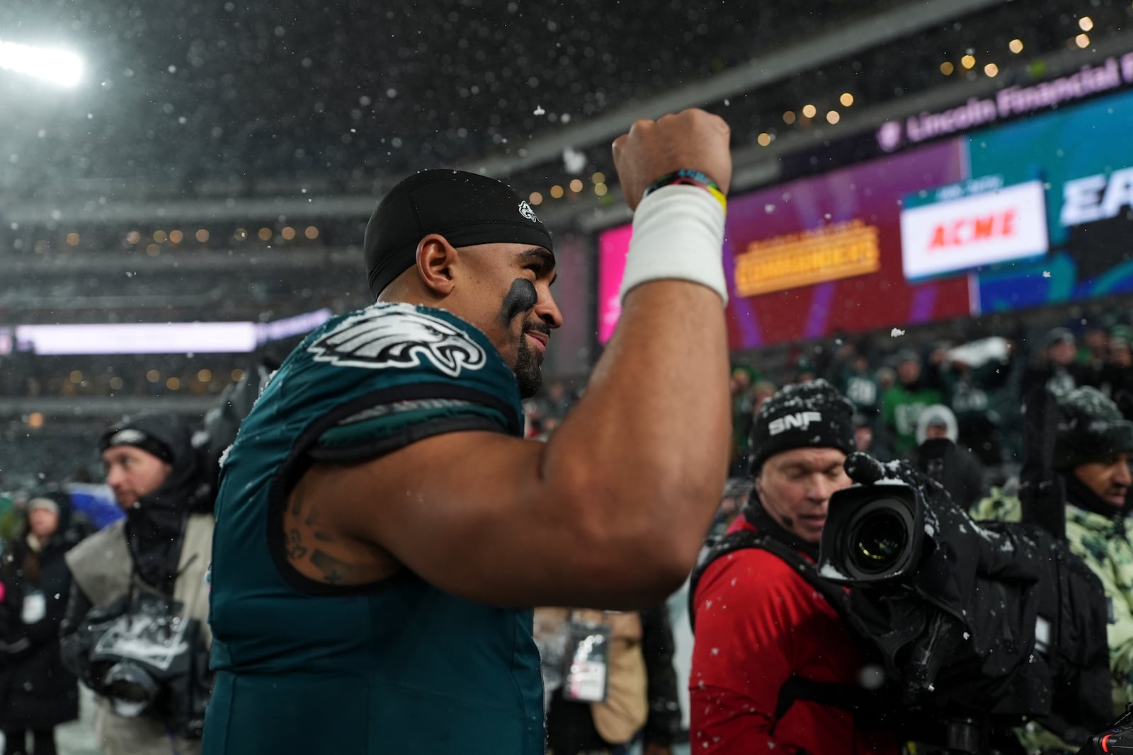 Philadelphia Eagles quarterback Jalen Hurts (1) gestures as he walks off the field after an NFL football NFC divisional playoff game against the Los Angeles Rams on Sunday, Jan. 19, 2025, in Philadelphia. (AP Photo/Matt Slocum)