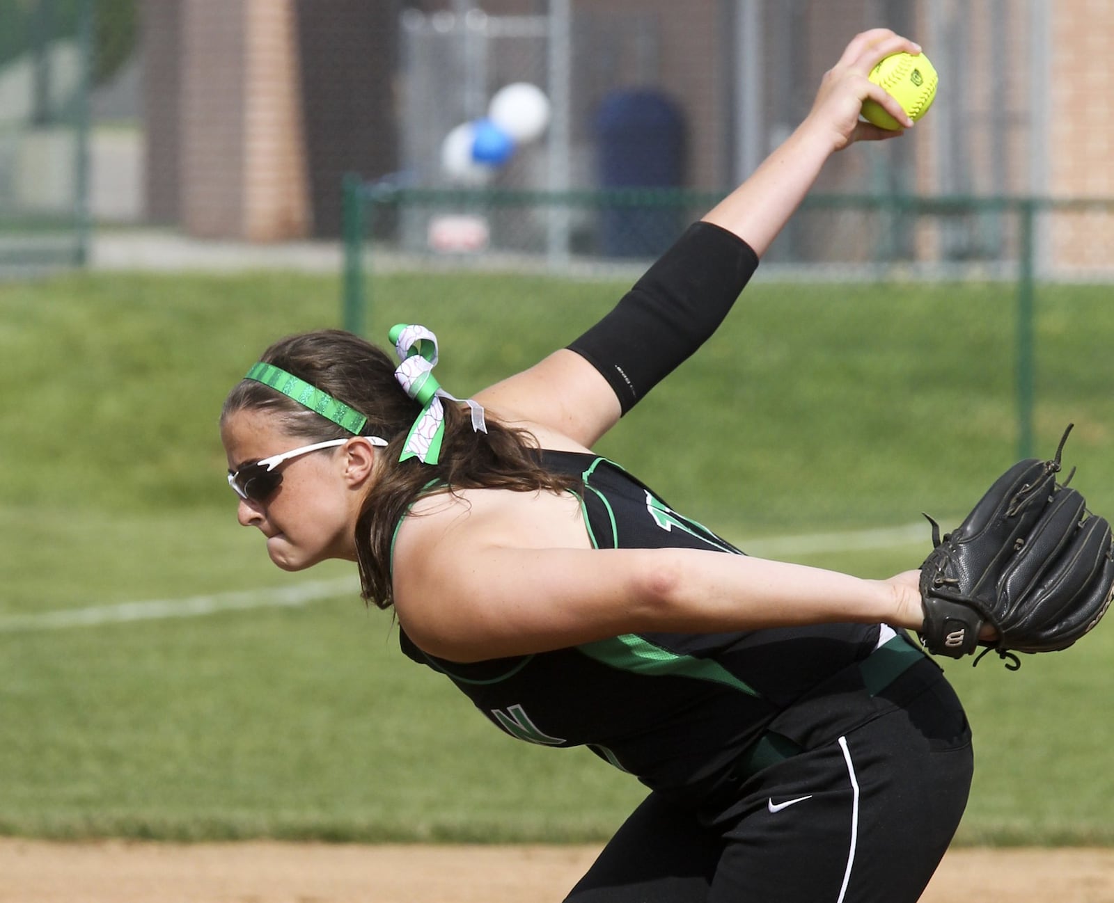 Badin pitcher Danielle Ray winds up and prepares to send a pitch toward the plate during a game at Hamilton on May 10, 2014. GREG LYNCH/STAFF