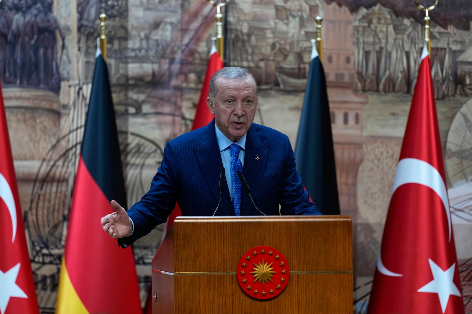 Turkey's President Recep Tayyip Erdogan, right, answers journalists questions during a presser with Germany's Chancellor Olaf Scholz, in Istanbul, Turkey, Saturday, Oct. 19, 2024. (AP Photo/Khalil Hamra)