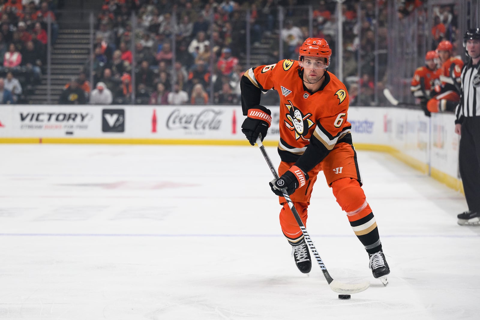 Anaheim Ducks defenseman Brian Dumoulin looks to pass the puck during the first period of an NHL hockey game against the Chicago Blackhawks, Saturday, March 1, 2025, in Anaheim, Calif. (AP Photo/William Liang)