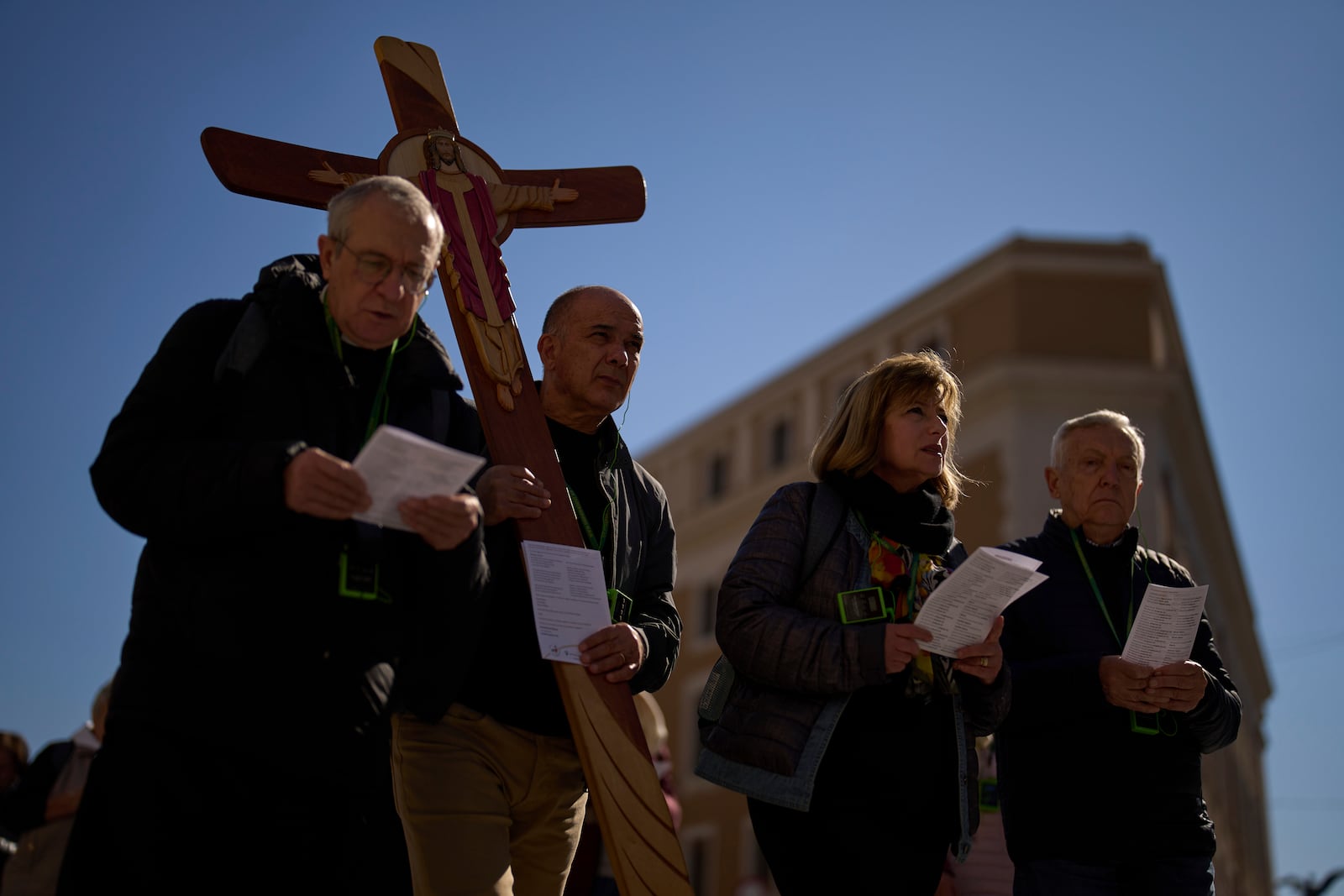 Christian Catholic worshippers pray as they walk towards St. Peter's Square, in Rome, Italy, Thursday, March 6, 2025. (AP Photo/Francisco Seco)