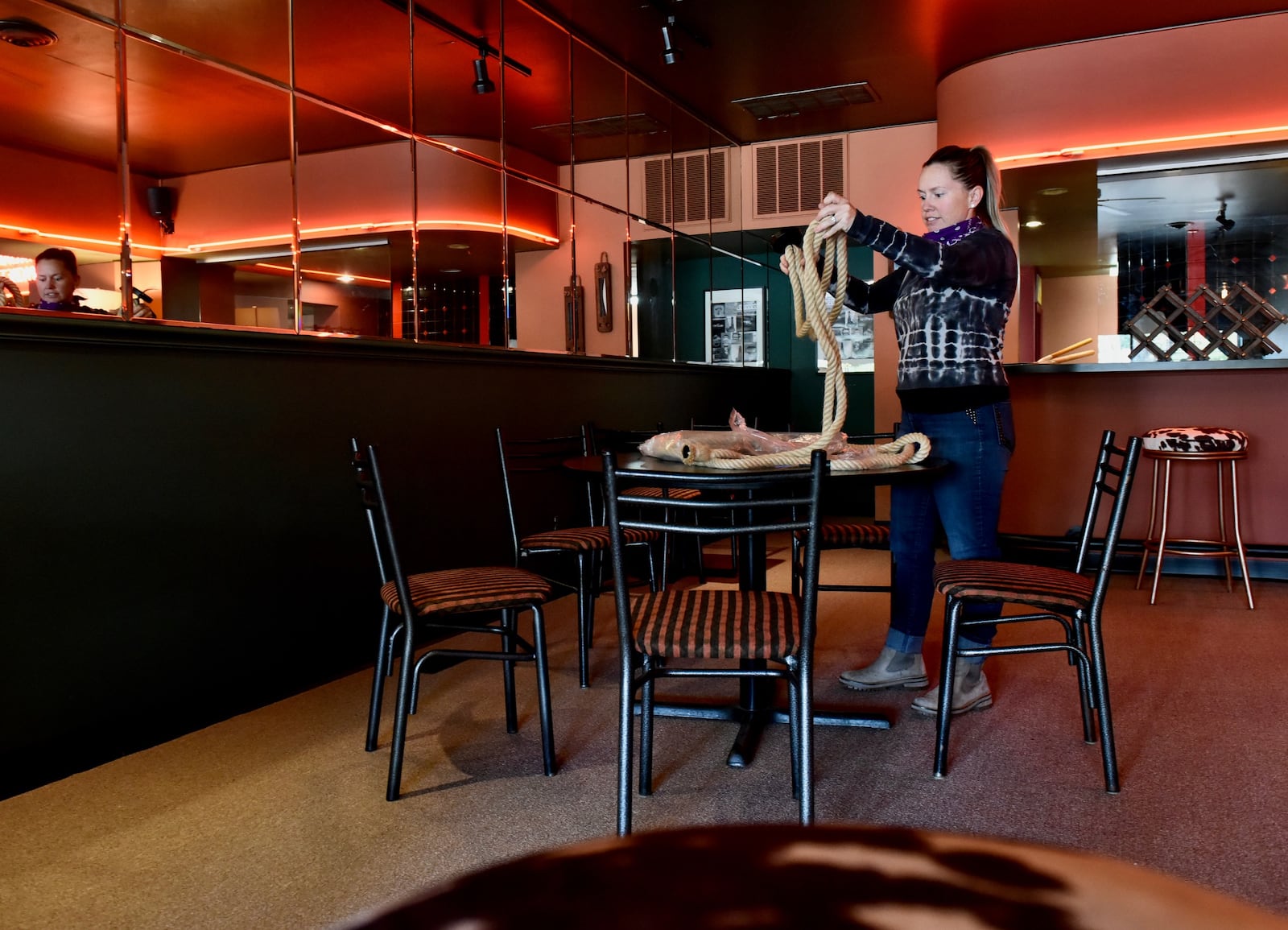 Bandanas Italian Eatery will open next month in the former Stefano's location on Central Avenue in Middletown. Monica Nenni, co-owner of Bandanas, works on some of the interior decorations. NICK GRAHAM/STAFF