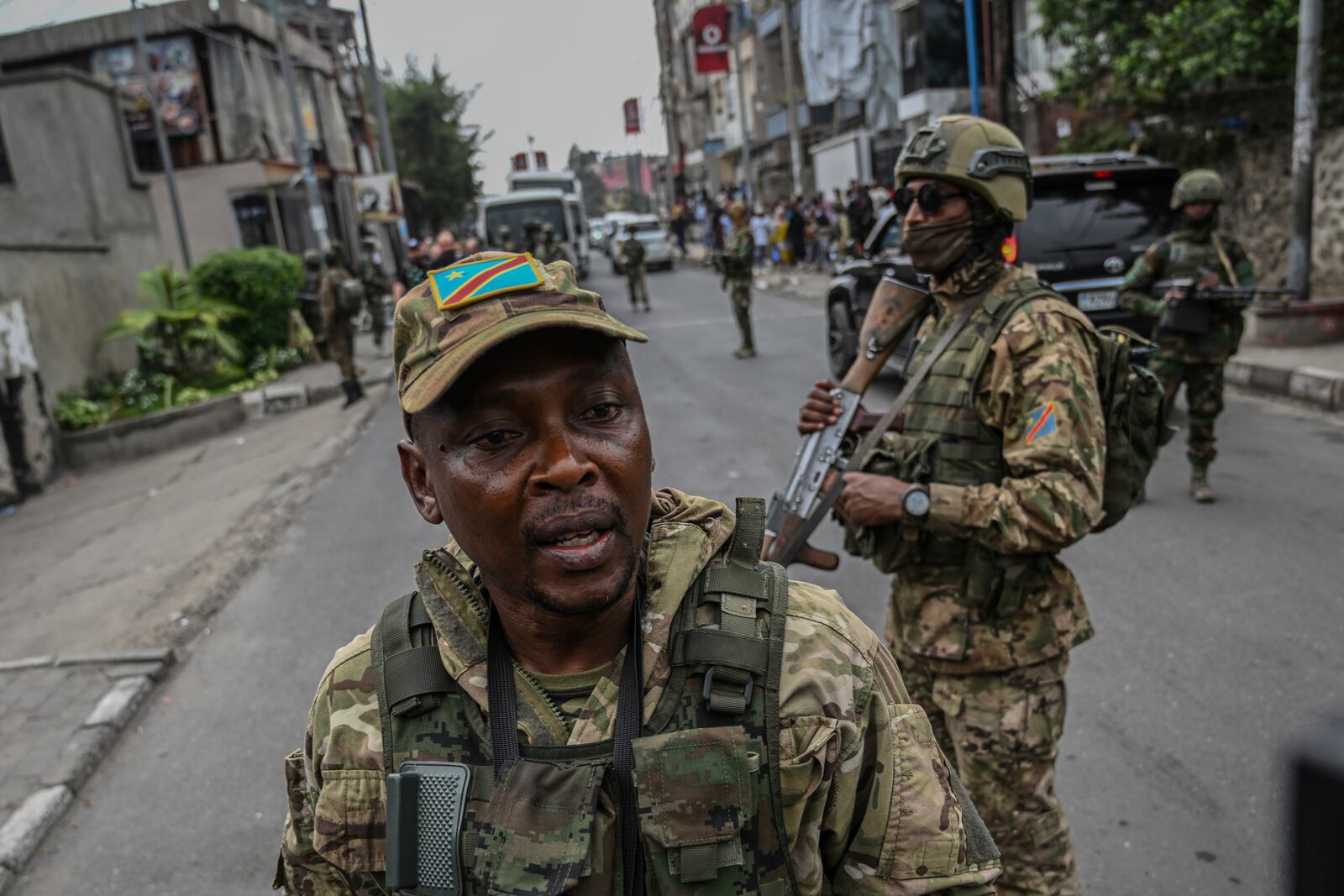 M23 rebels escort Romanian mercenaries to the border crossing into Rwanda in Goma, Democratic Republic of Congo, Wednesday, Jan. 29, 2025.(AP Photo/Moses Sawasawa)