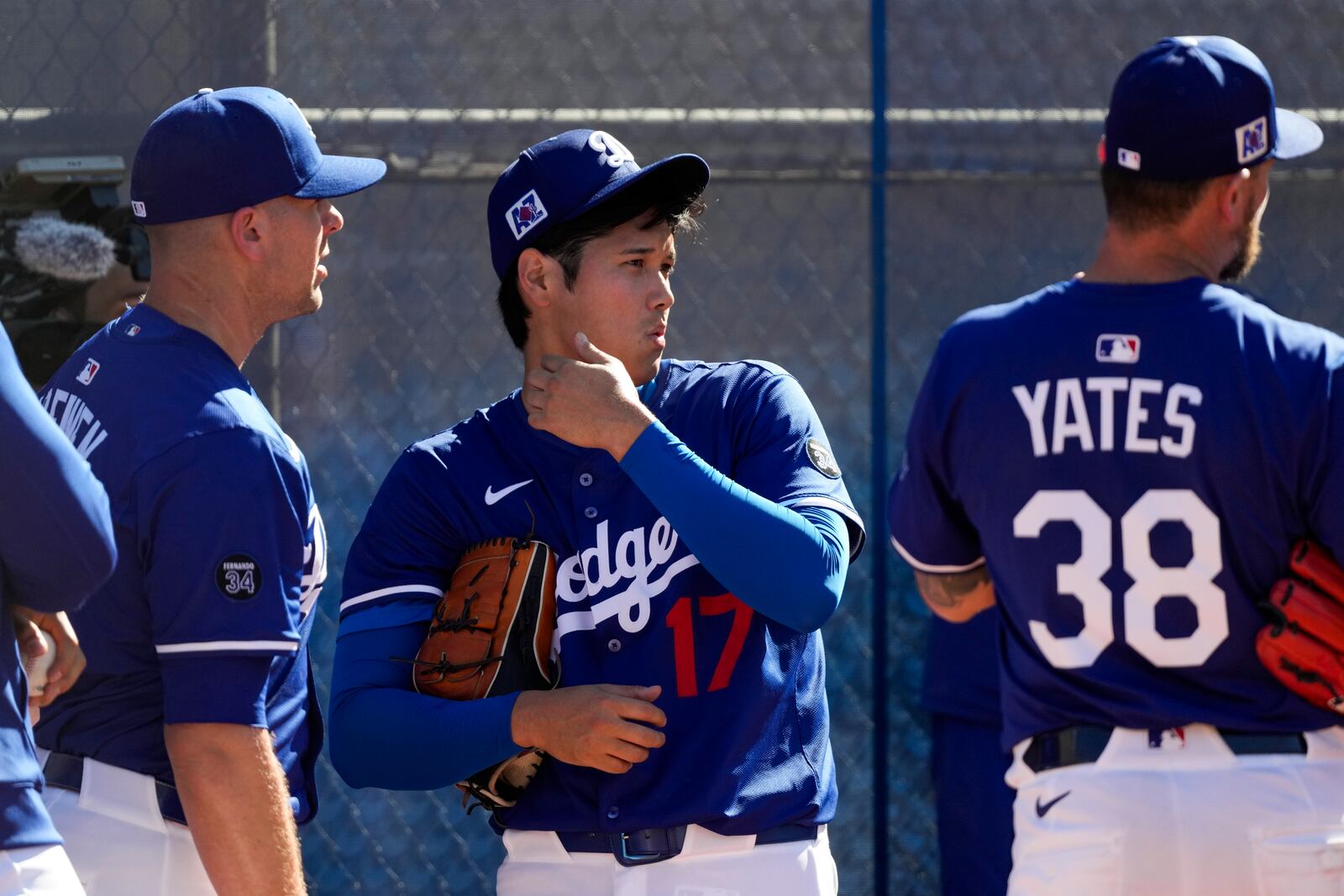 Los Angeles Dodgers two-way player Shohei Ohtani (17) works out during spring training baseball practice, Saturday, Feb. 15, 2025, in Phoenix. (AP Photo/Ashley Landis)