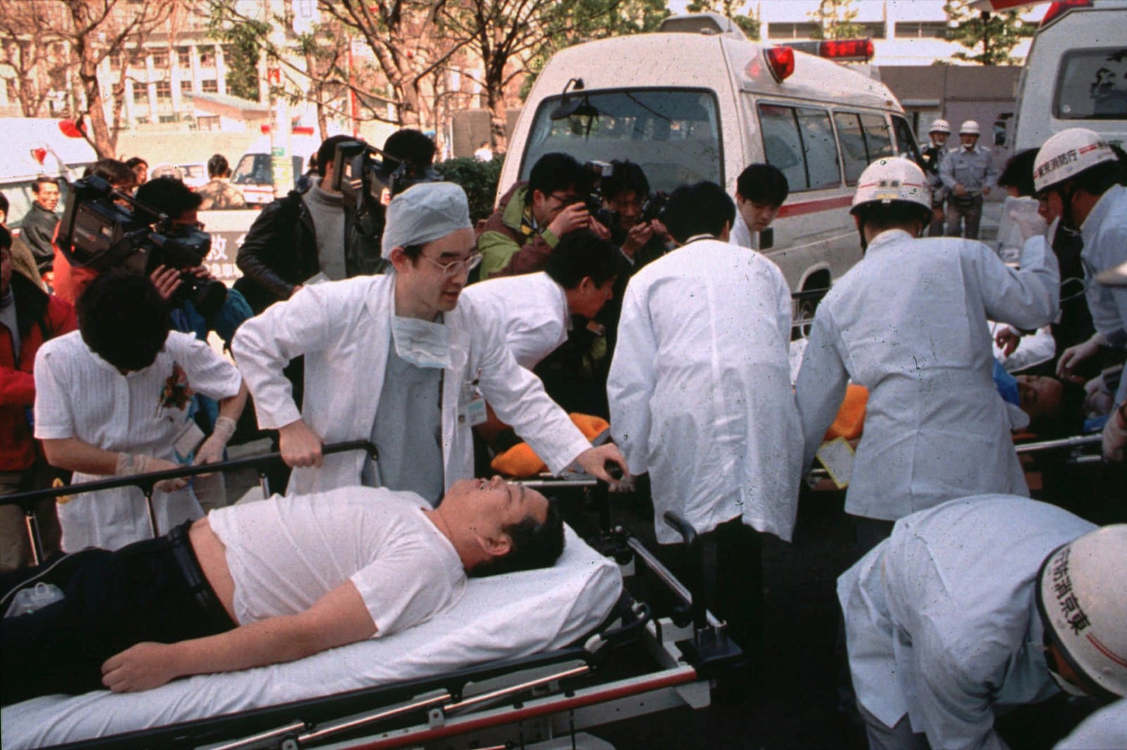 FILE - Subway passengers affected by sarin nerve gas in the central Tokyo subway trains are carried into St. Luke's International Hospital in Tokyo on March 20, 1995. (AP Photo/Chiaki Tsukumo, File)